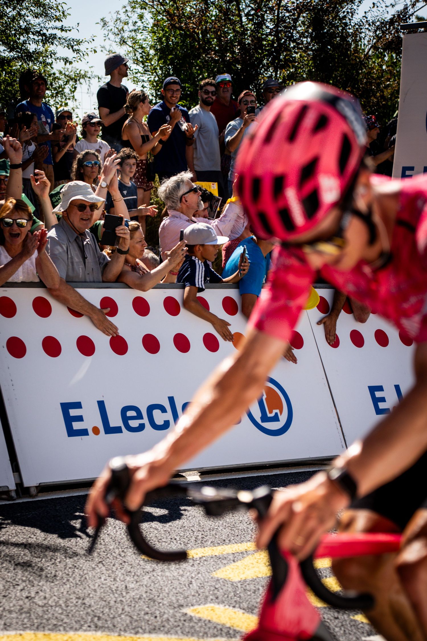 Action photography of cyclists during the Tour de France, motion, energy and determination in a dynamic sports atmosphere.