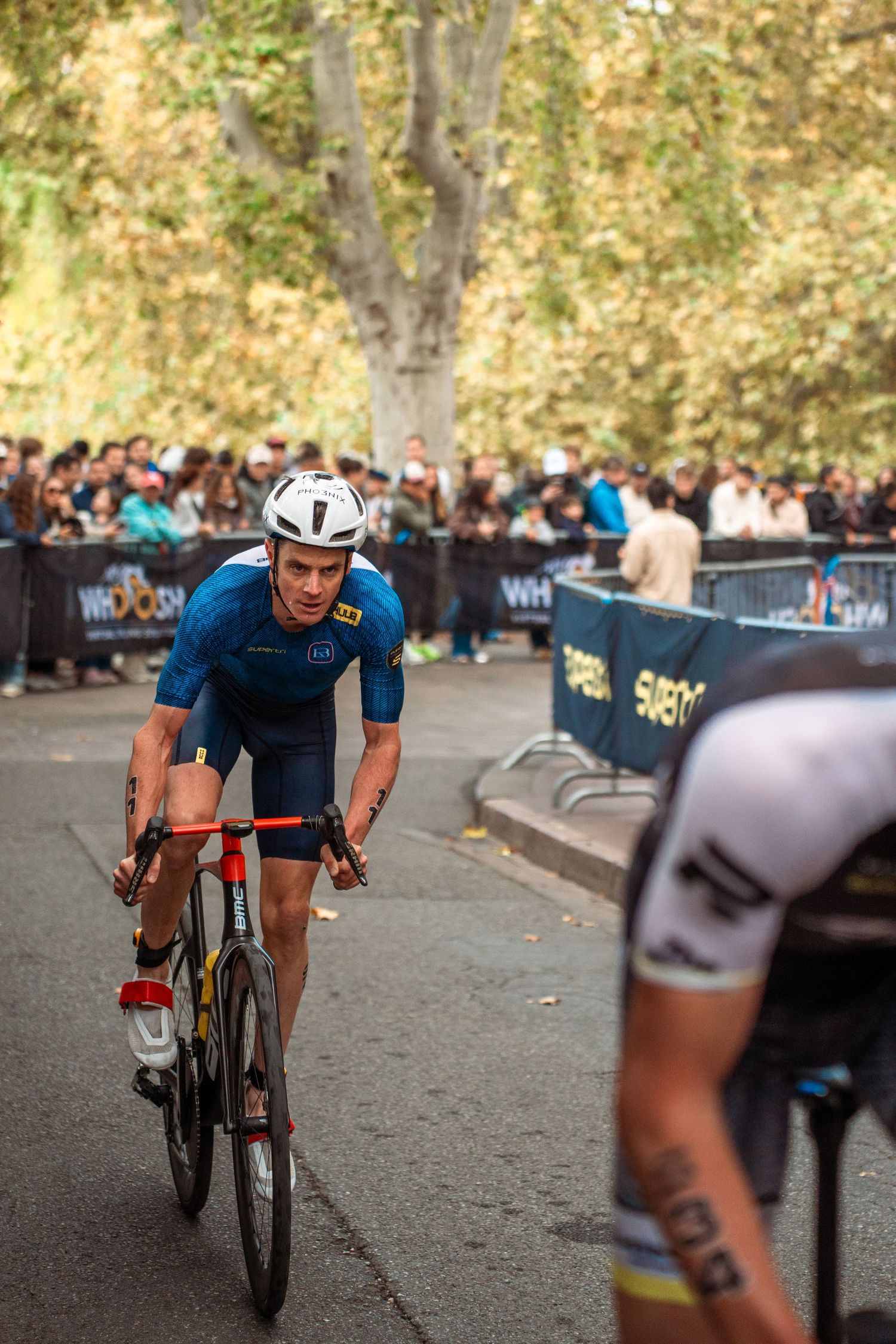 Triathlon competition photography capturing endurance athletes in motion, strength, focus and intense sporting atmosphere.