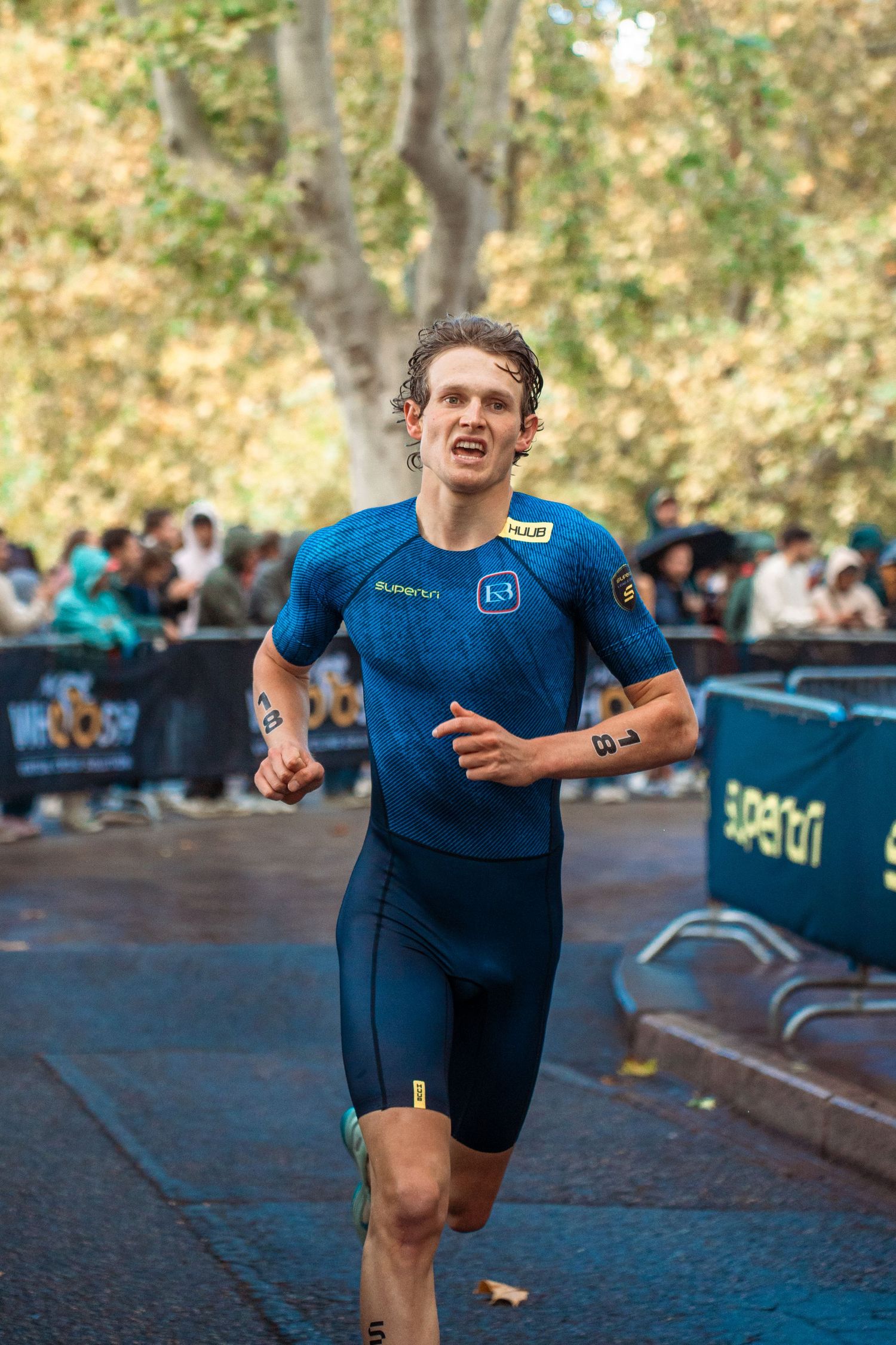 Triathlon competition photography capturing endurance athletes in motion, strength, focus and intense sporting atmosphere.