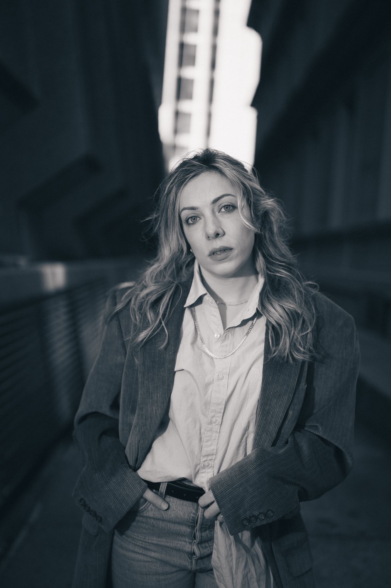 Dramatic black and white portrait series with moody lighting and shadows.