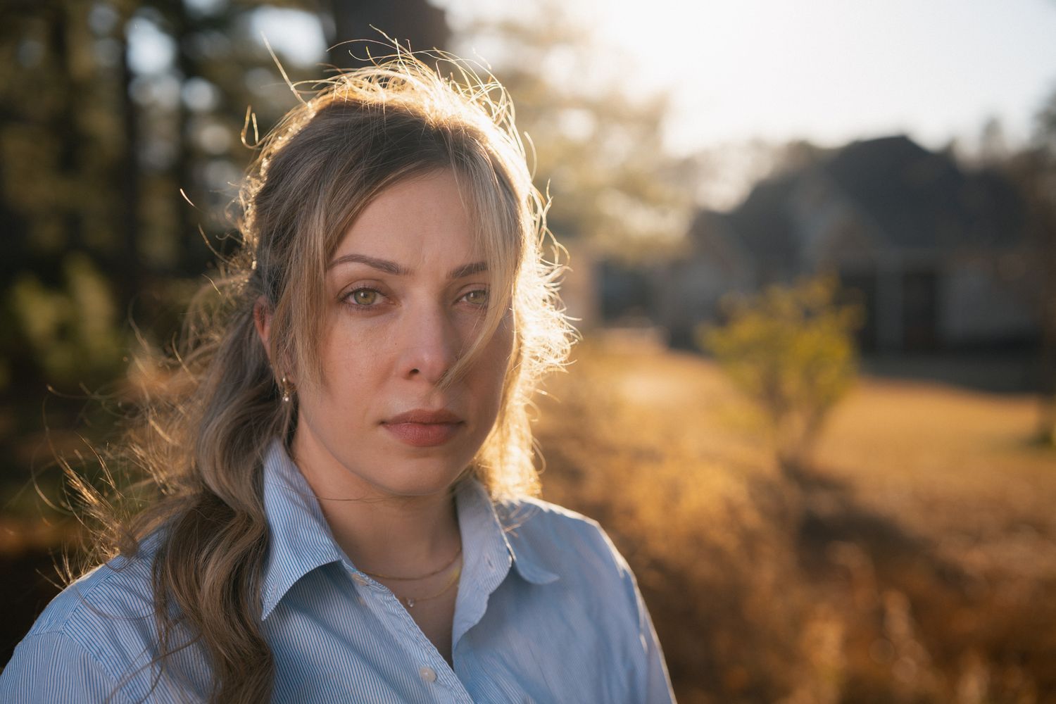 Golden hour portrait session with warm autumn lighting and bokeh effects.