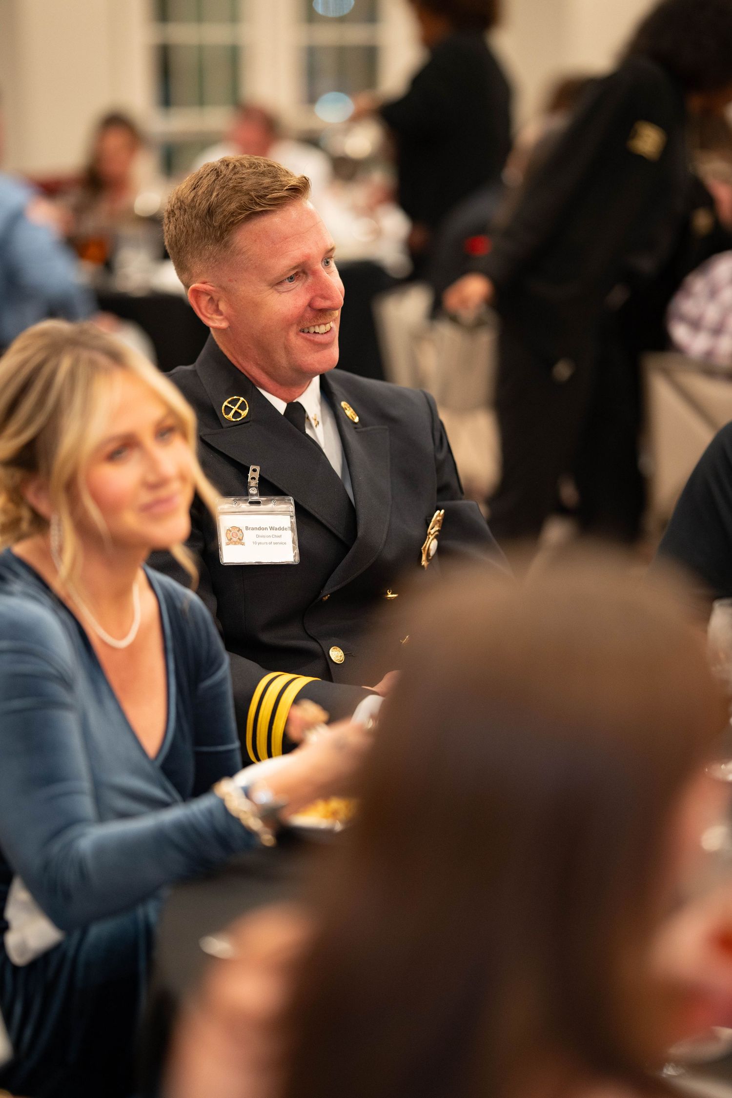 A series of candid shots from a formal event showing people in professional attire.