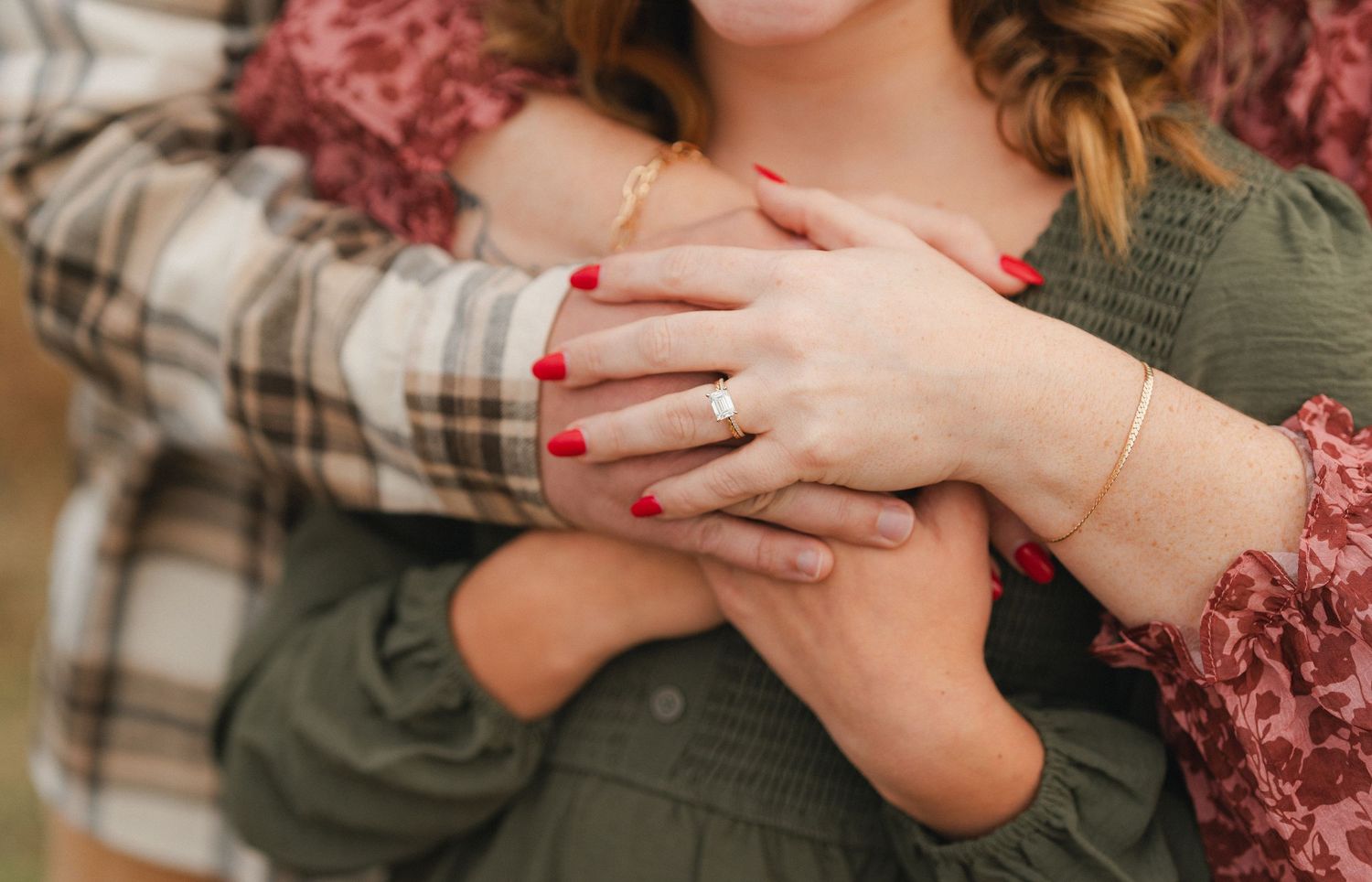 Close-up details of hands and clothing in warm autumn tones.