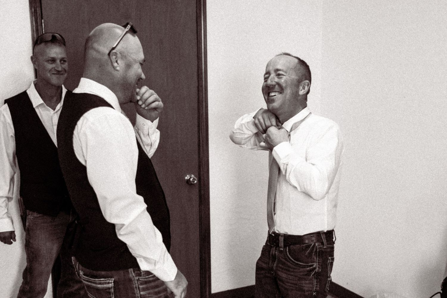 A sequence of black and white photos showing people dancing and celebrating at a party.