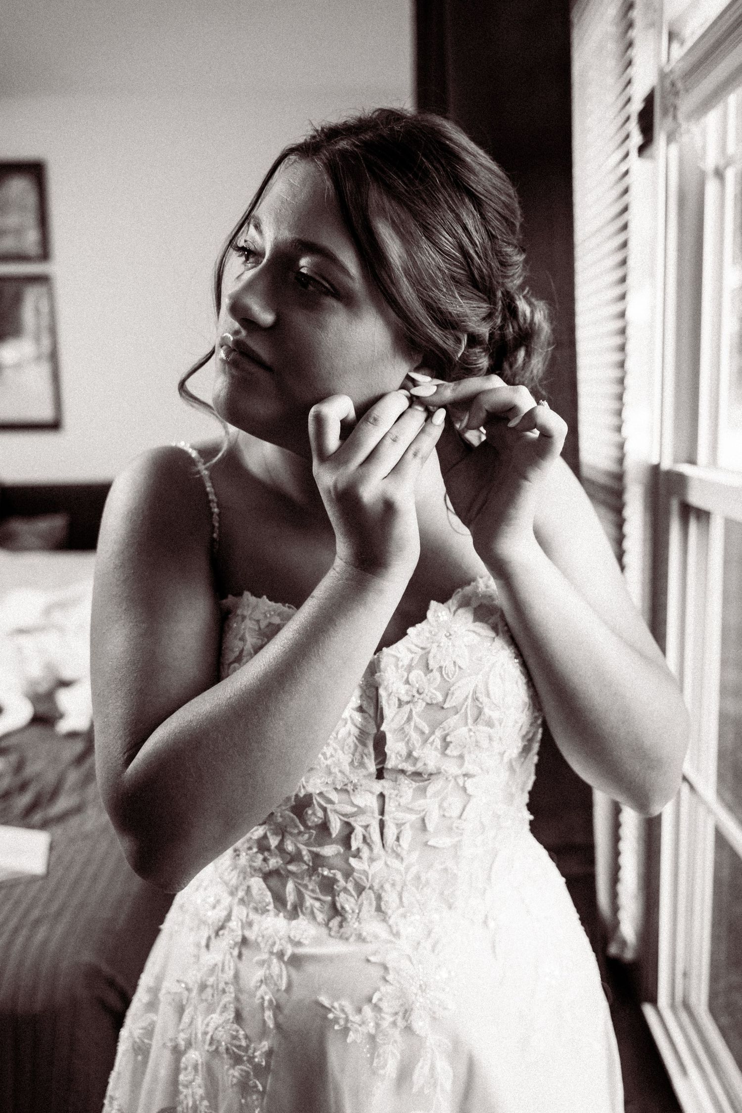 Black and white photos show delicate lace details on a wedding dress.