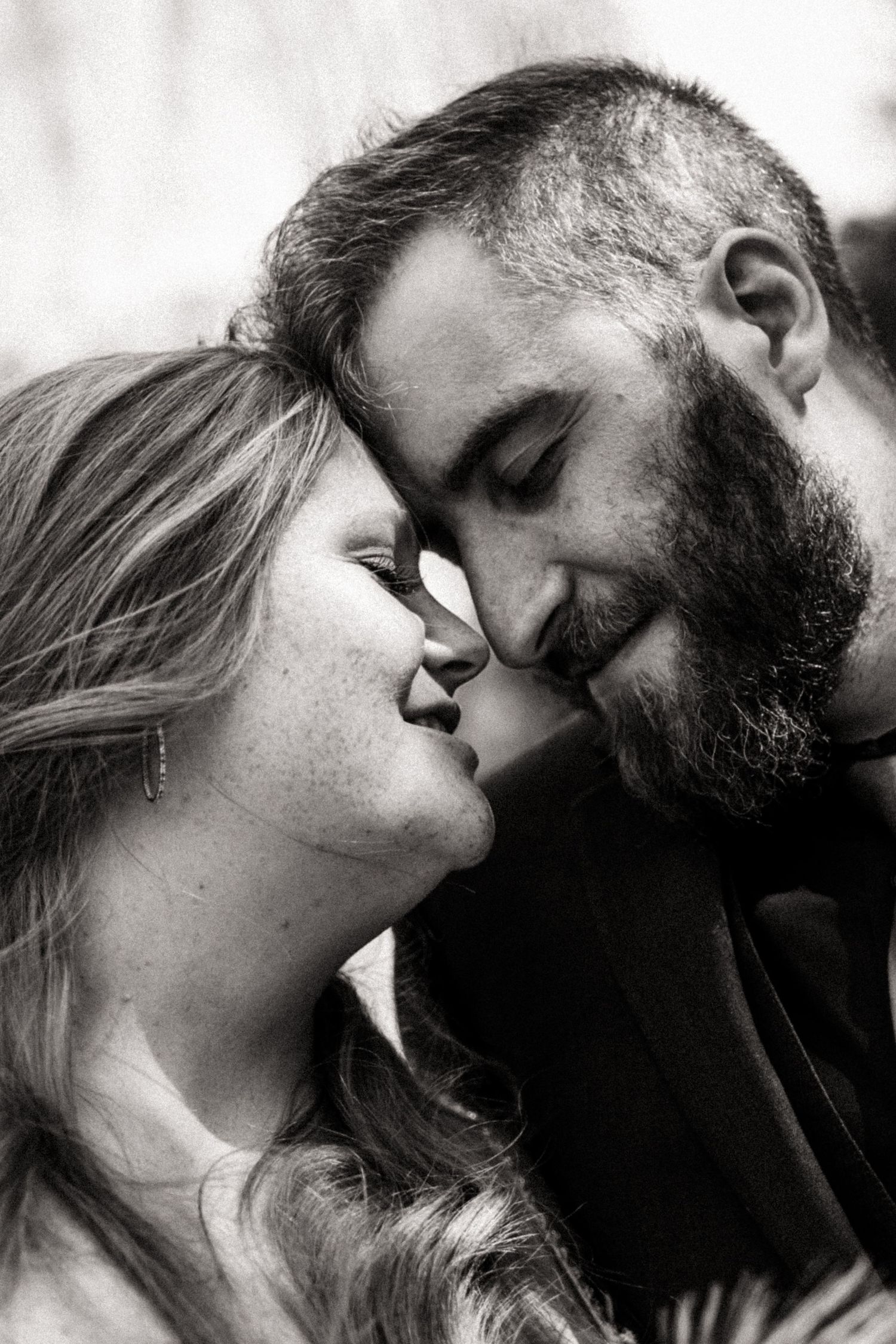 A collection of intimate black and white profile shots showing romantic moments between a couple.