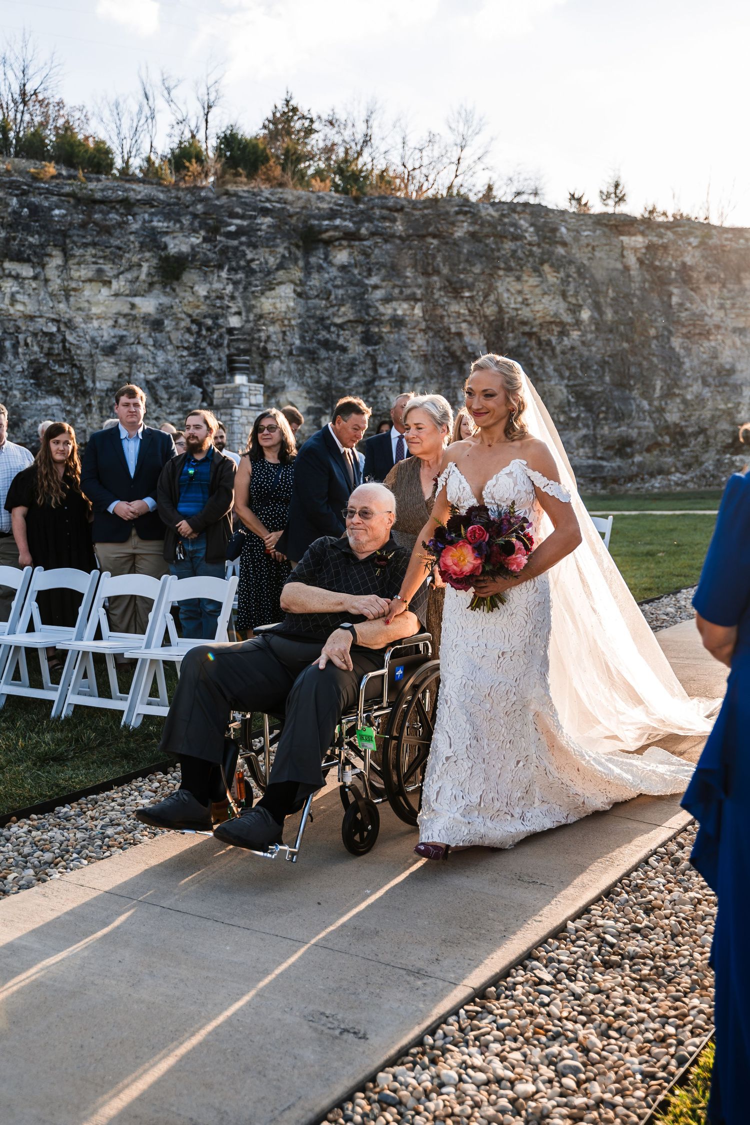 A sequence of wedding photos showing guests seated outdoors by a stone wall during a ceremony at sunset.