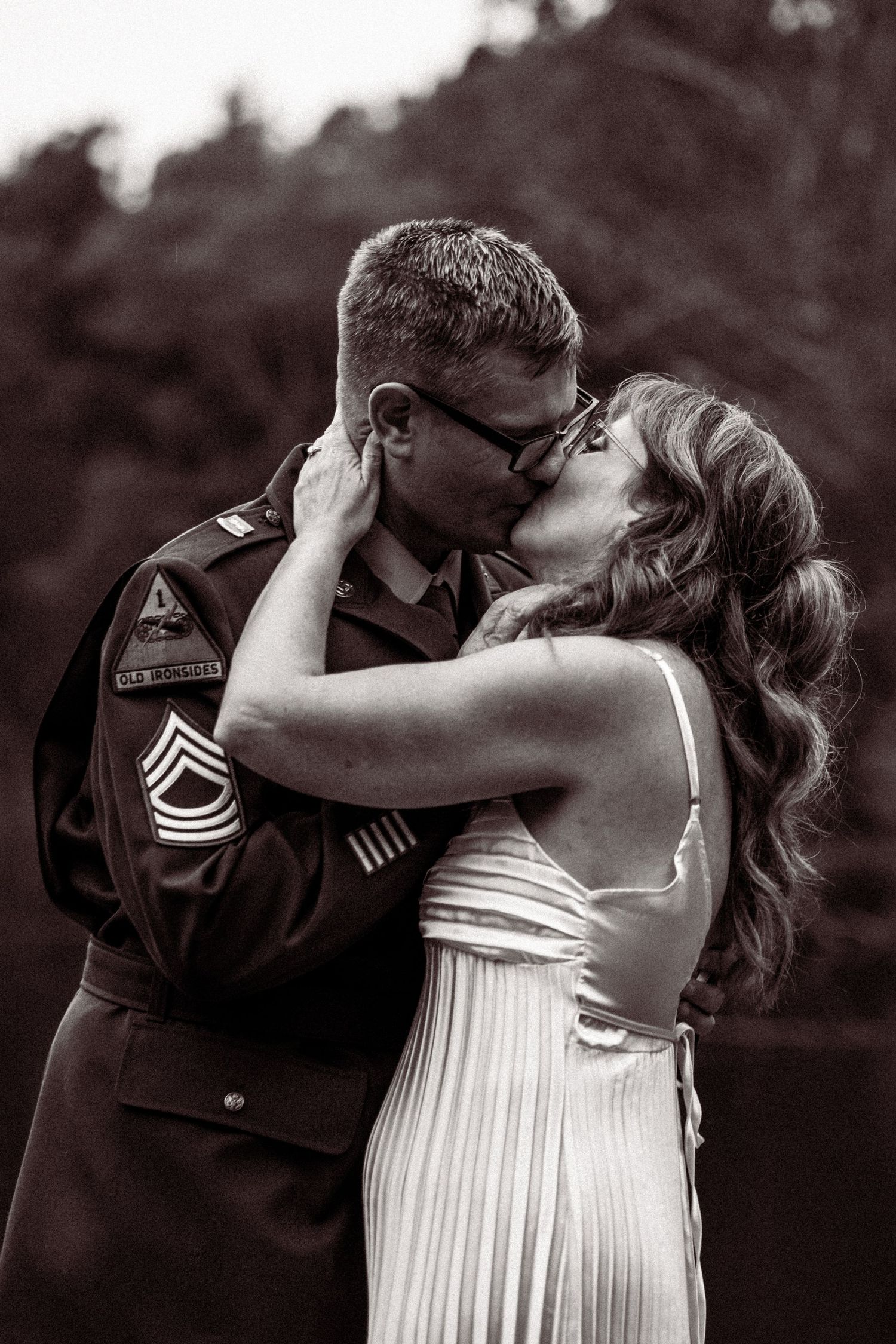 Black and white photos capture romantic moments between newlyweds outdoors.