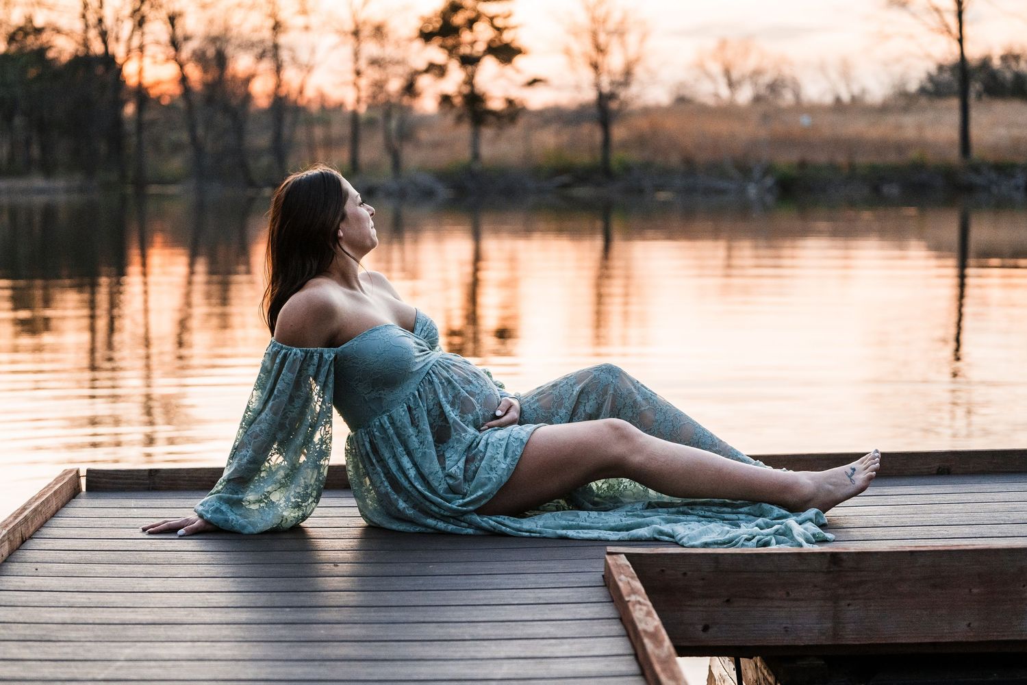 Person in denim relaxing on wooden dock by tranquil lake at sunset in multiple artistic poses.