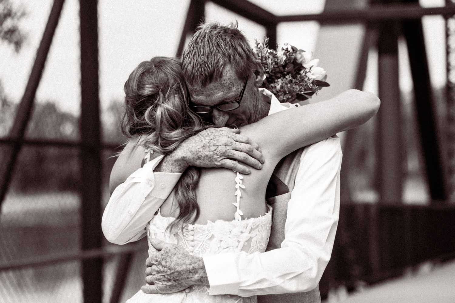 Romantic black and white wedding photos showing embraces and candid moments.