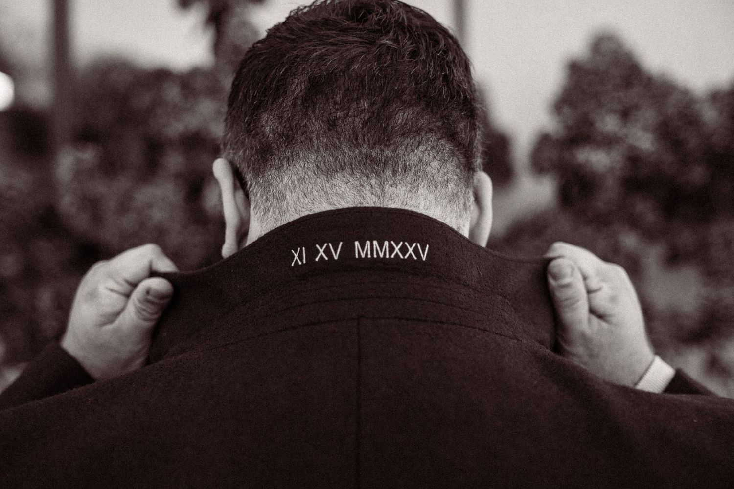 Black and white artistic photo showing details of formal attire.