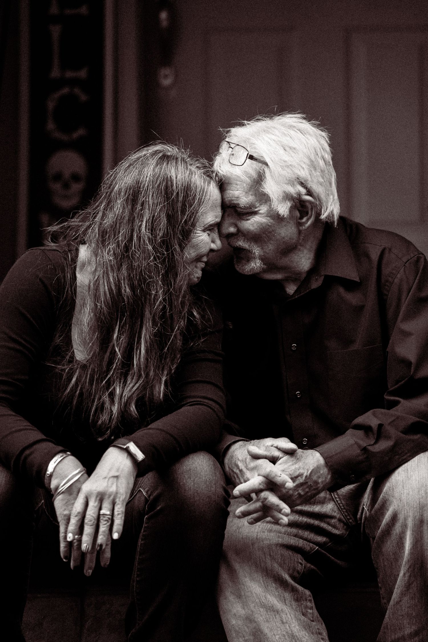 A series of black and white photographs showing a couple embracing in progressive intimate poses.