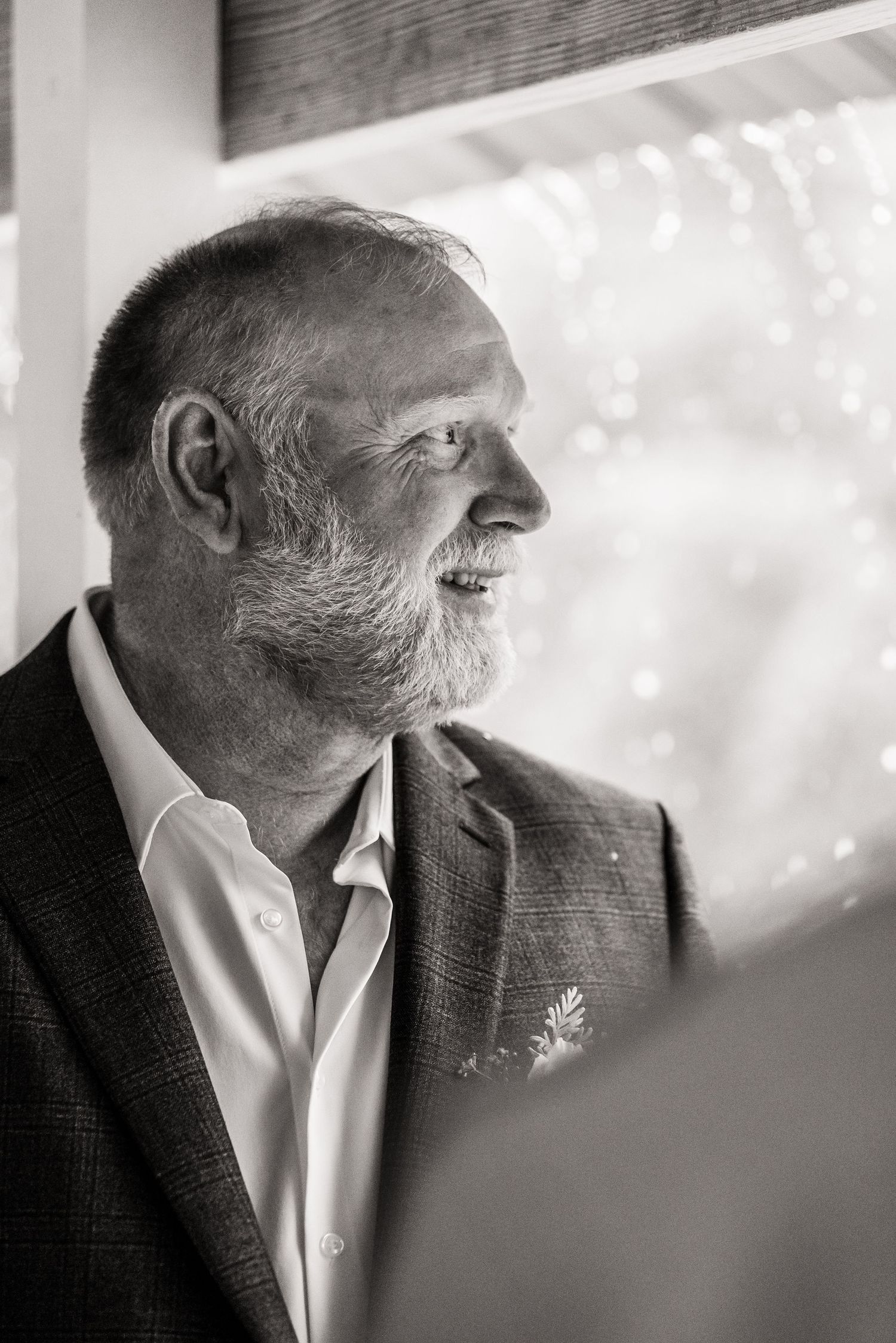 Artistic black and white profile portrait showing wedding day emotion.