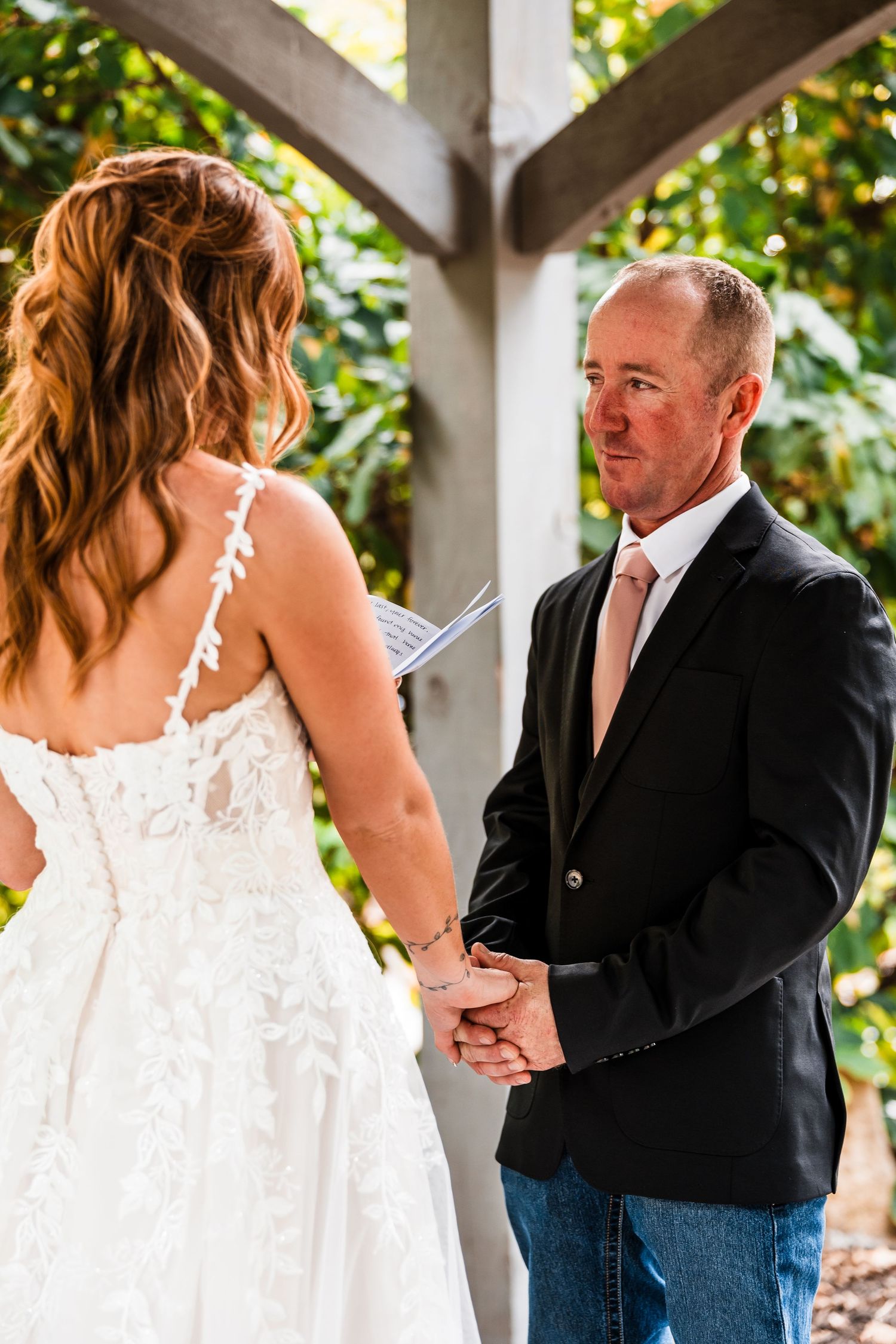 A series of wedding photos showing a couple in white dress and dark suit under a wooden pergola.