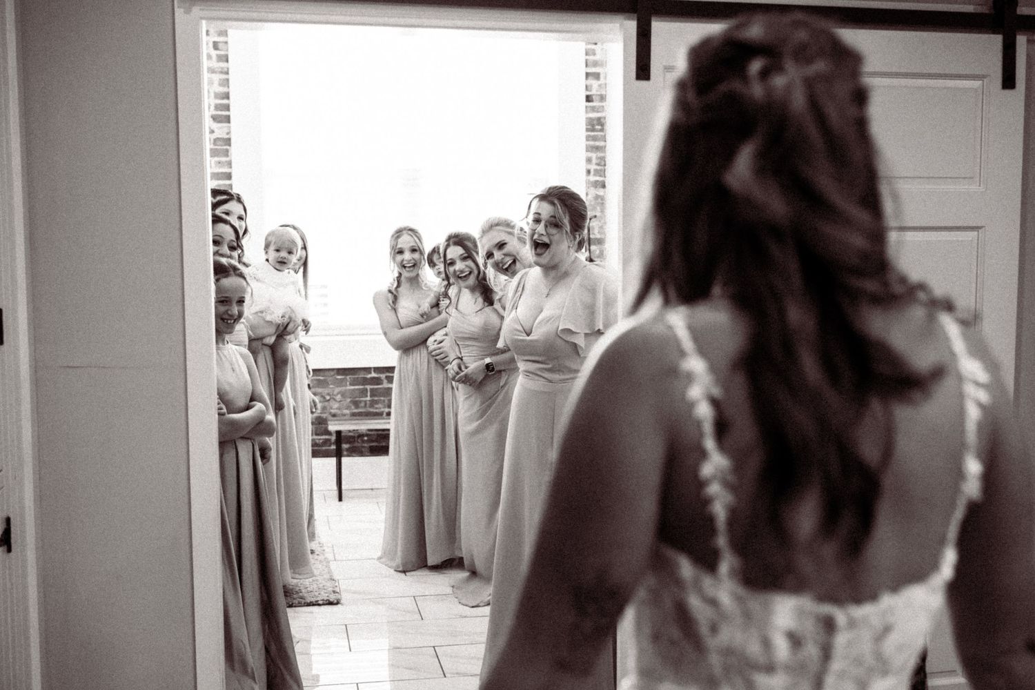 A series of candid wedding preparation moments shown in black and white photography.