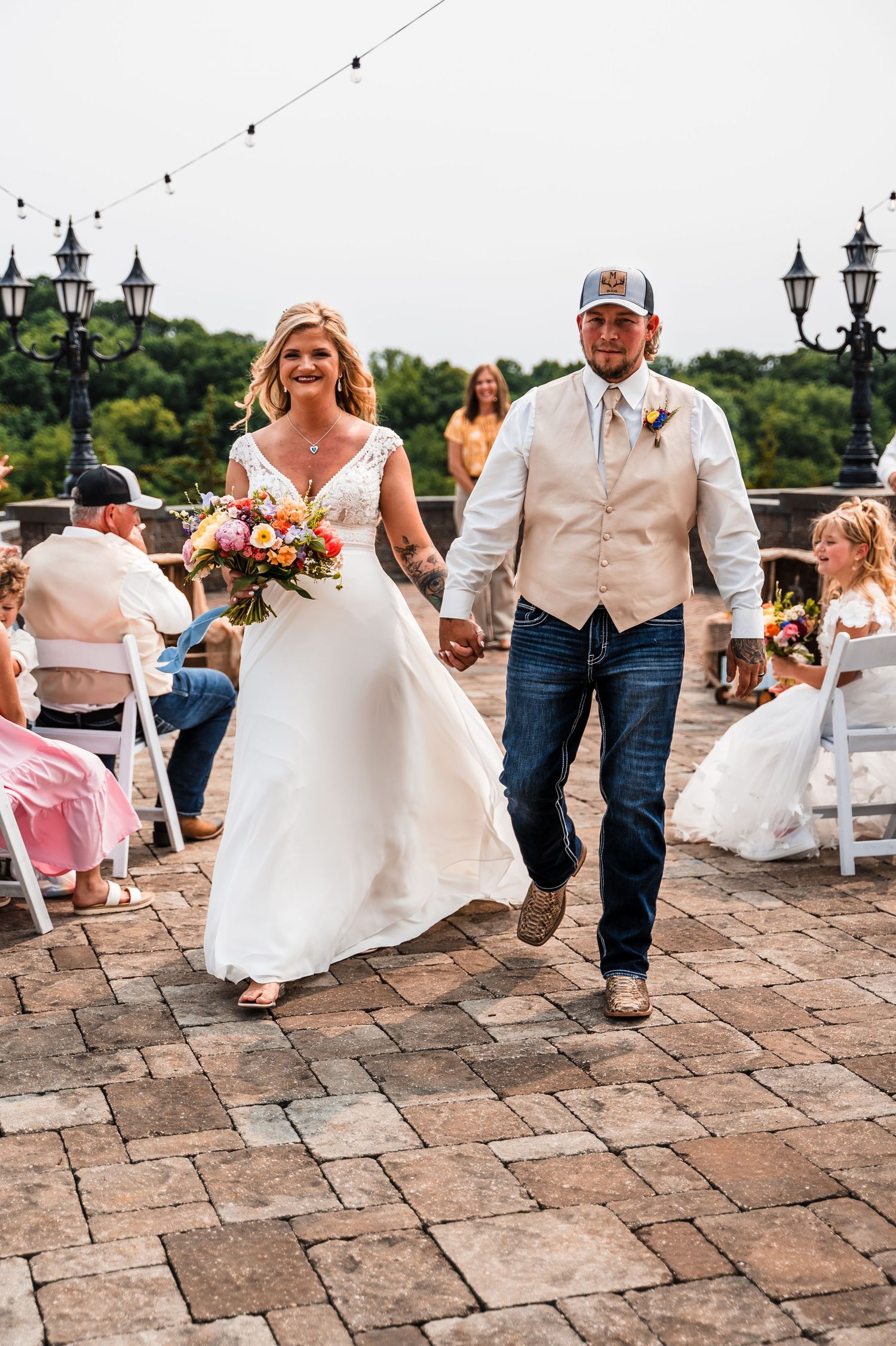 A series of photos showing a bride and groom dancing together on a stone patio with guests in casual attire.