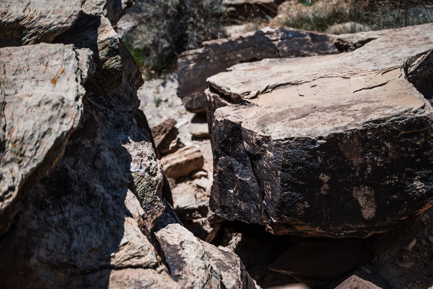 Close-up detail of rugged rock formations with deep shadows and crevices.