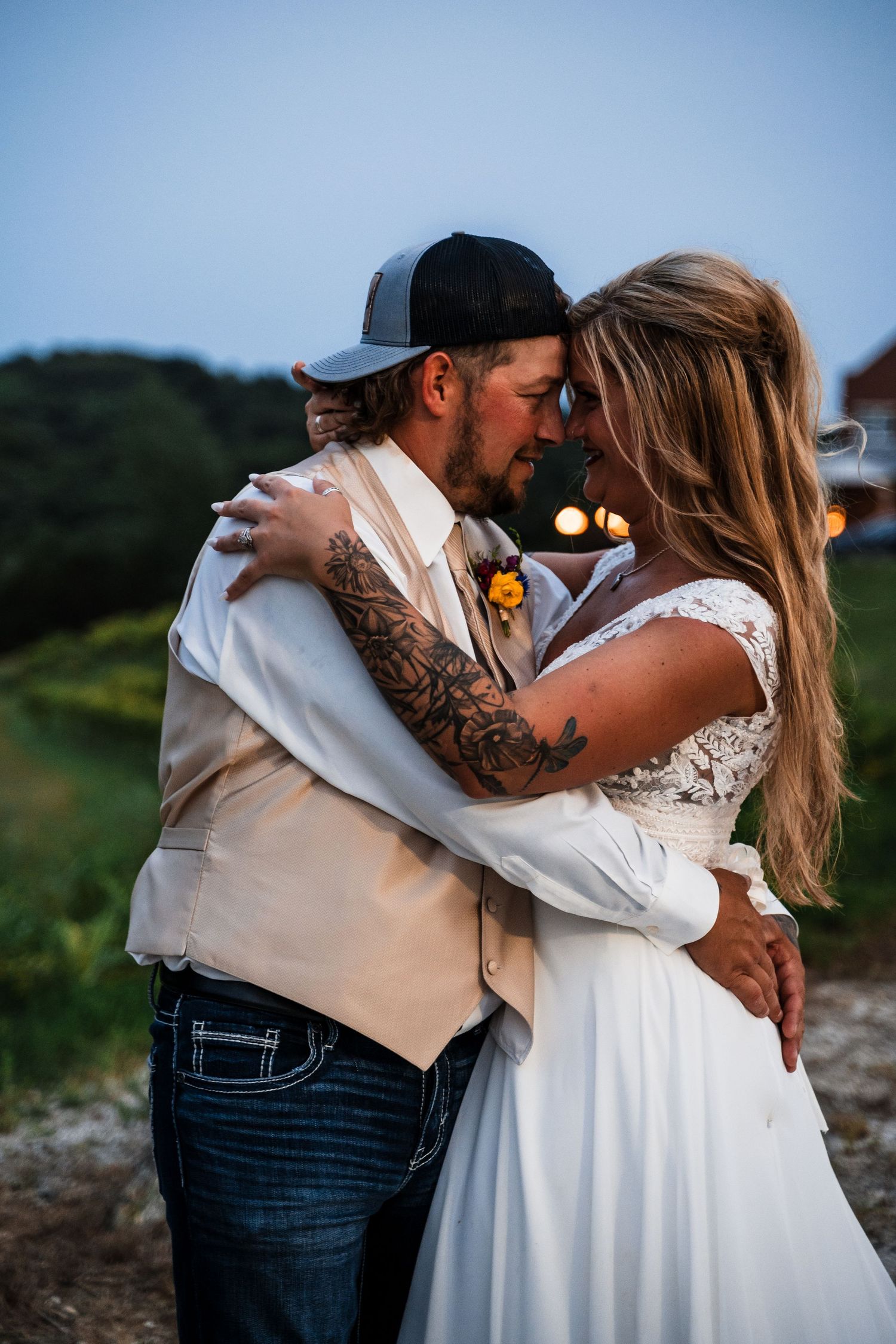 Romantic wedding photo sequence shows newly married couple embracing and dancing in a sunset meadow setting.
