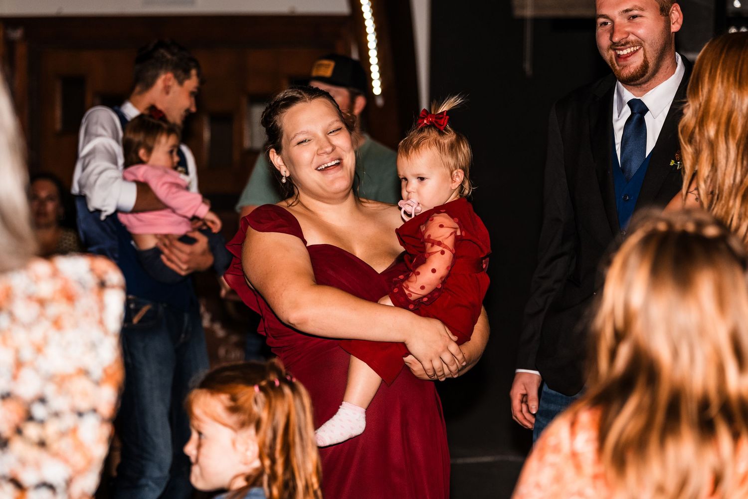 Wedding reception dance floor filled with guests enjoying the celebration.