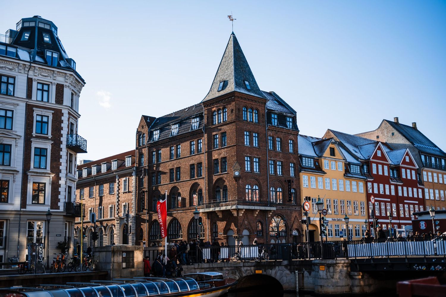 Historic buildings with traditional German architecture line a cobblestone street in the old town district at sunset.