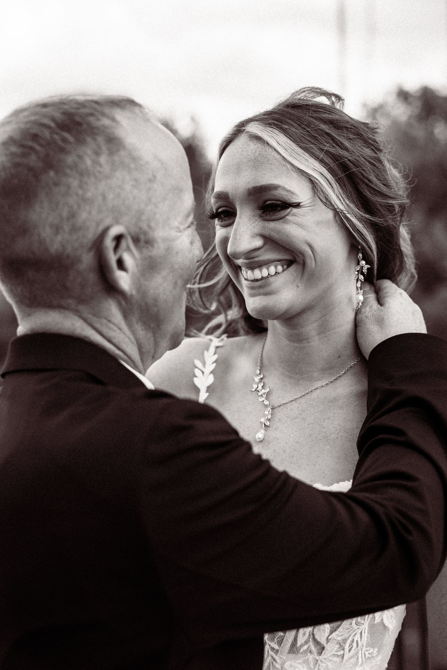 A sequence of romantic black and white photos showing tender moments between a couple on their wedding day.