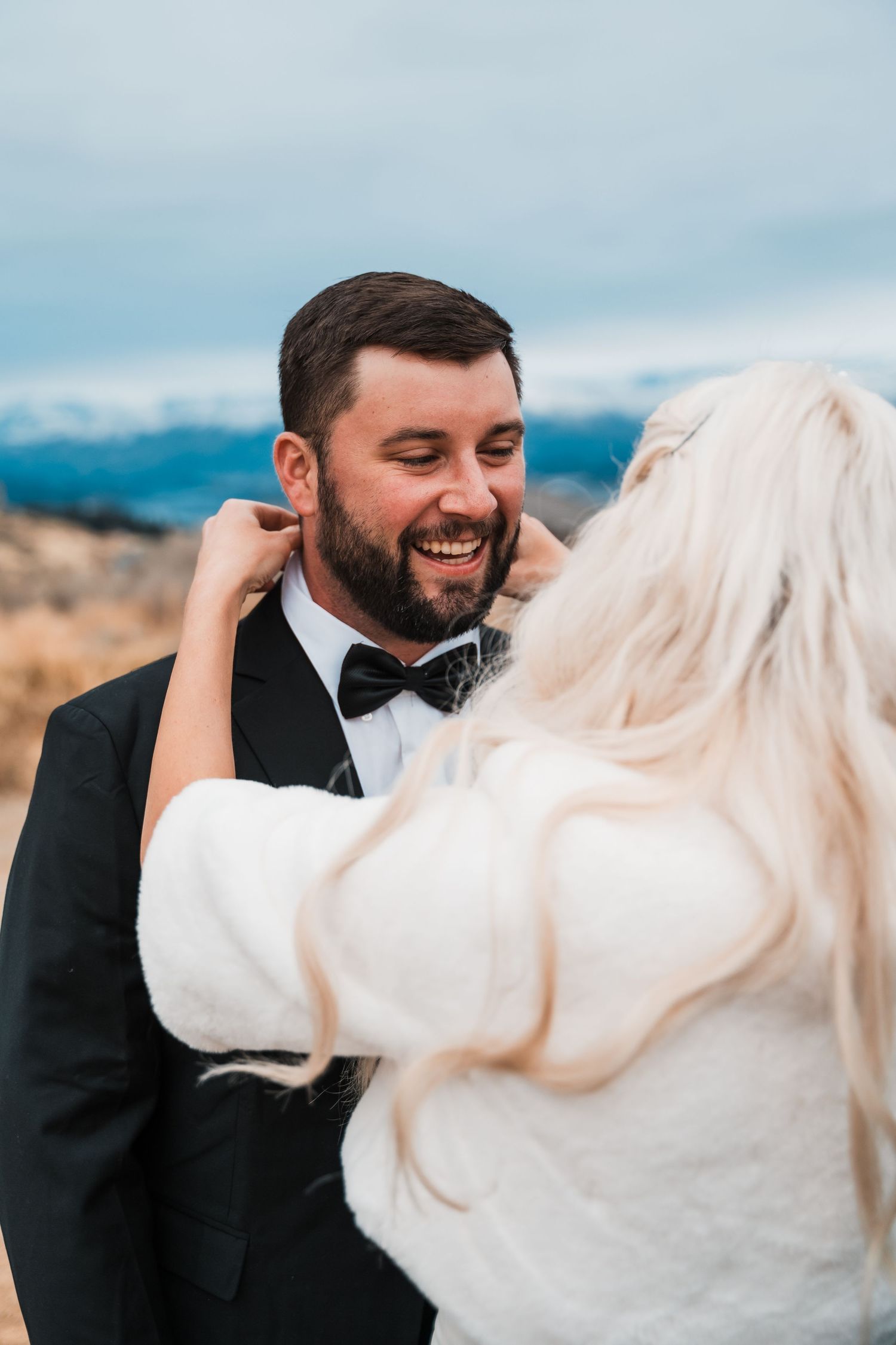 A joyful moment captured during a mountain wedding celebration.