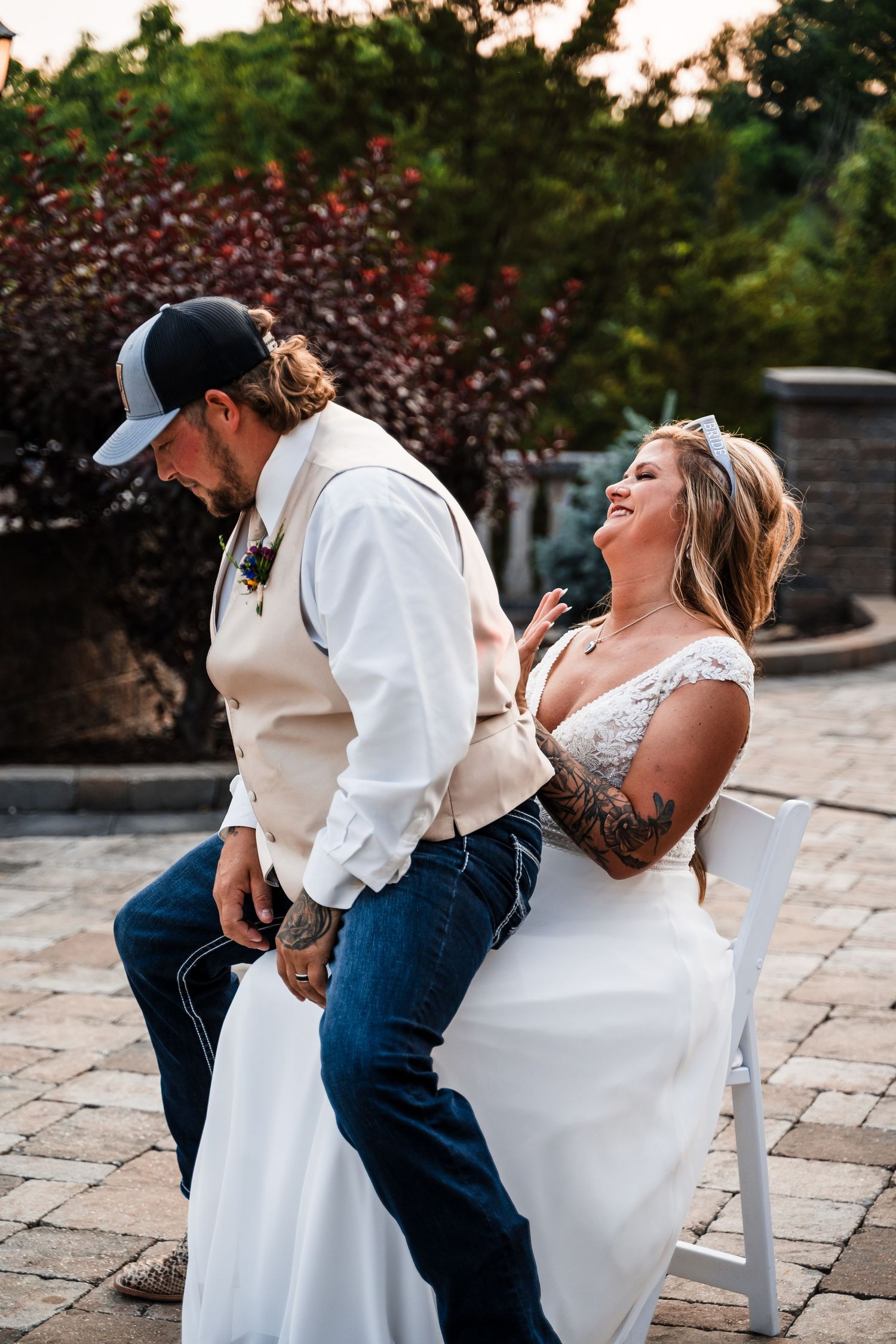 Candid moments captured during wedding dances on an outdoor stone patio.