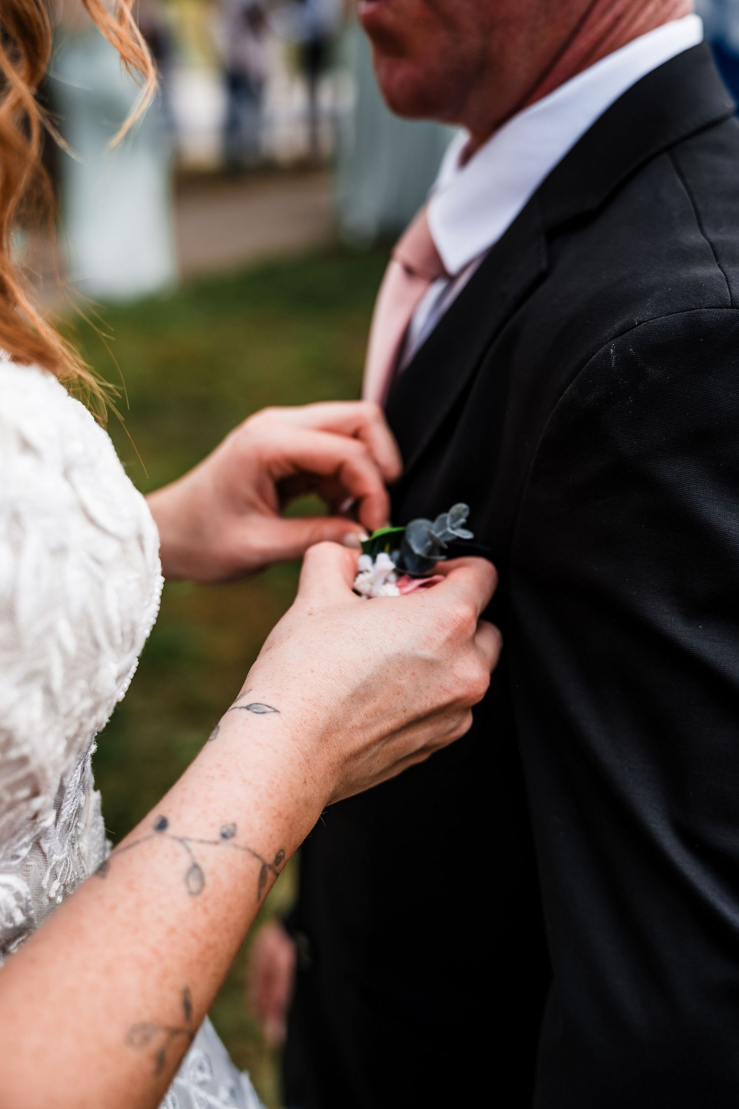Close-up shots of hands adjusting formal wedding attire and accessories.