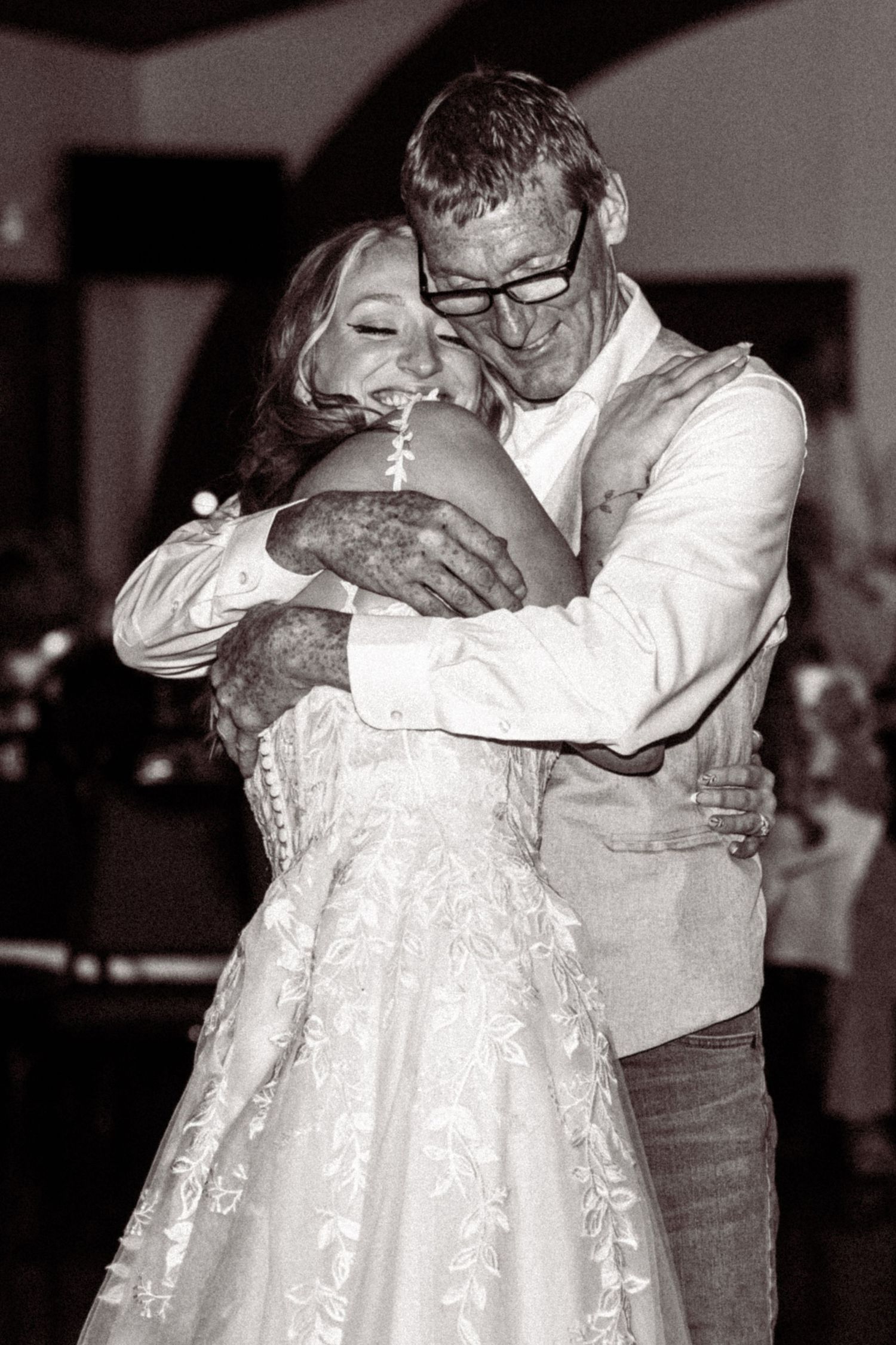 A series of black and white photographs showing a tender dance between a bride in a lace dress and her partner.