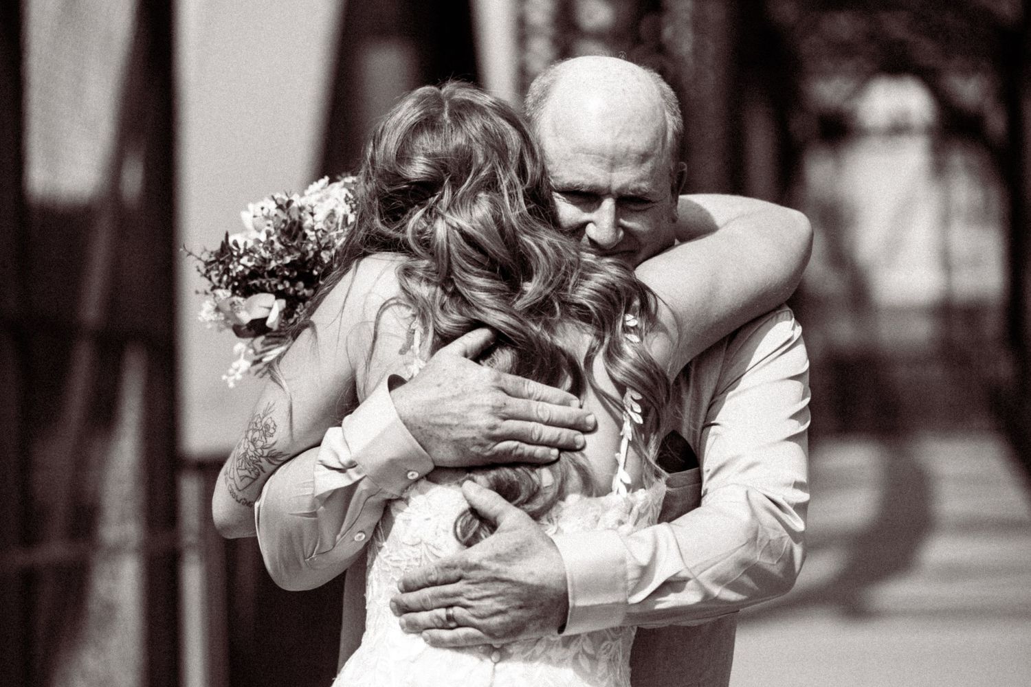 A series of black and white photos showing emotional embraces and celebrations.