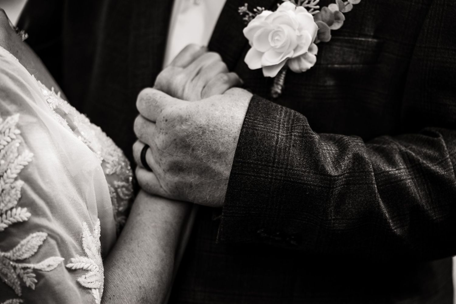 Black and white close-up wedding photography showing emotional intimate moments.