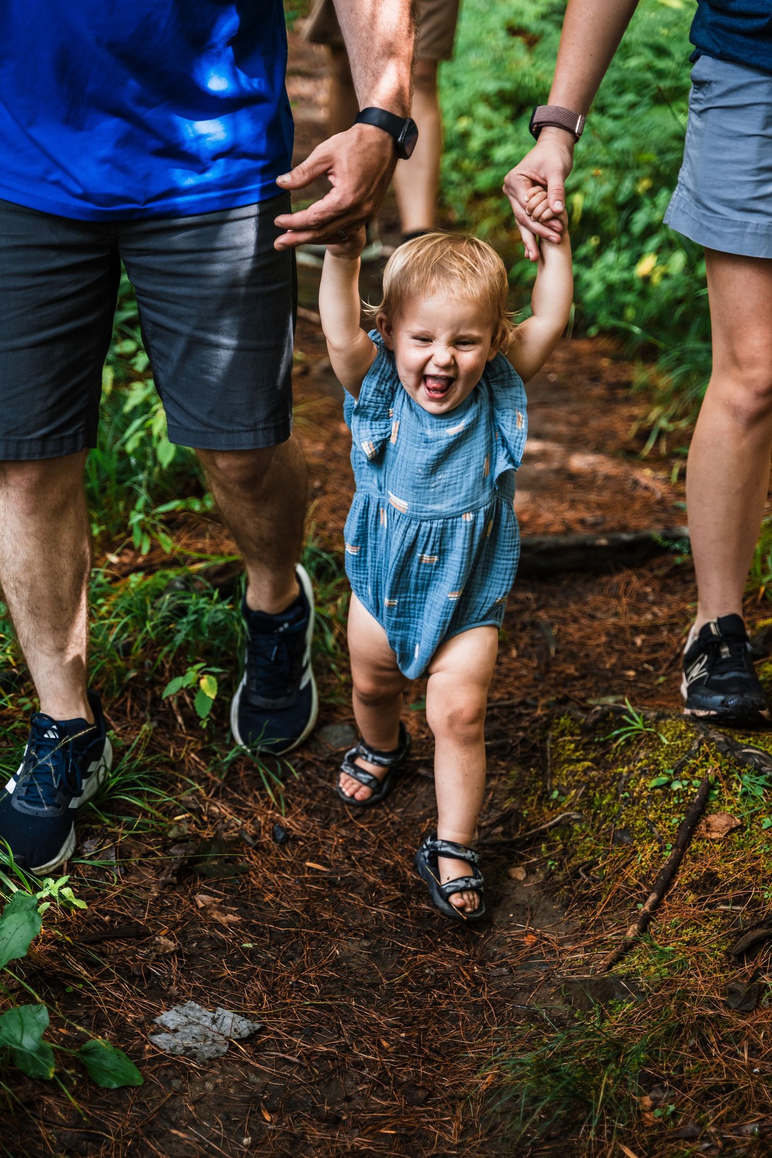 A joyful moment walking along a forest trail on a sunny day.