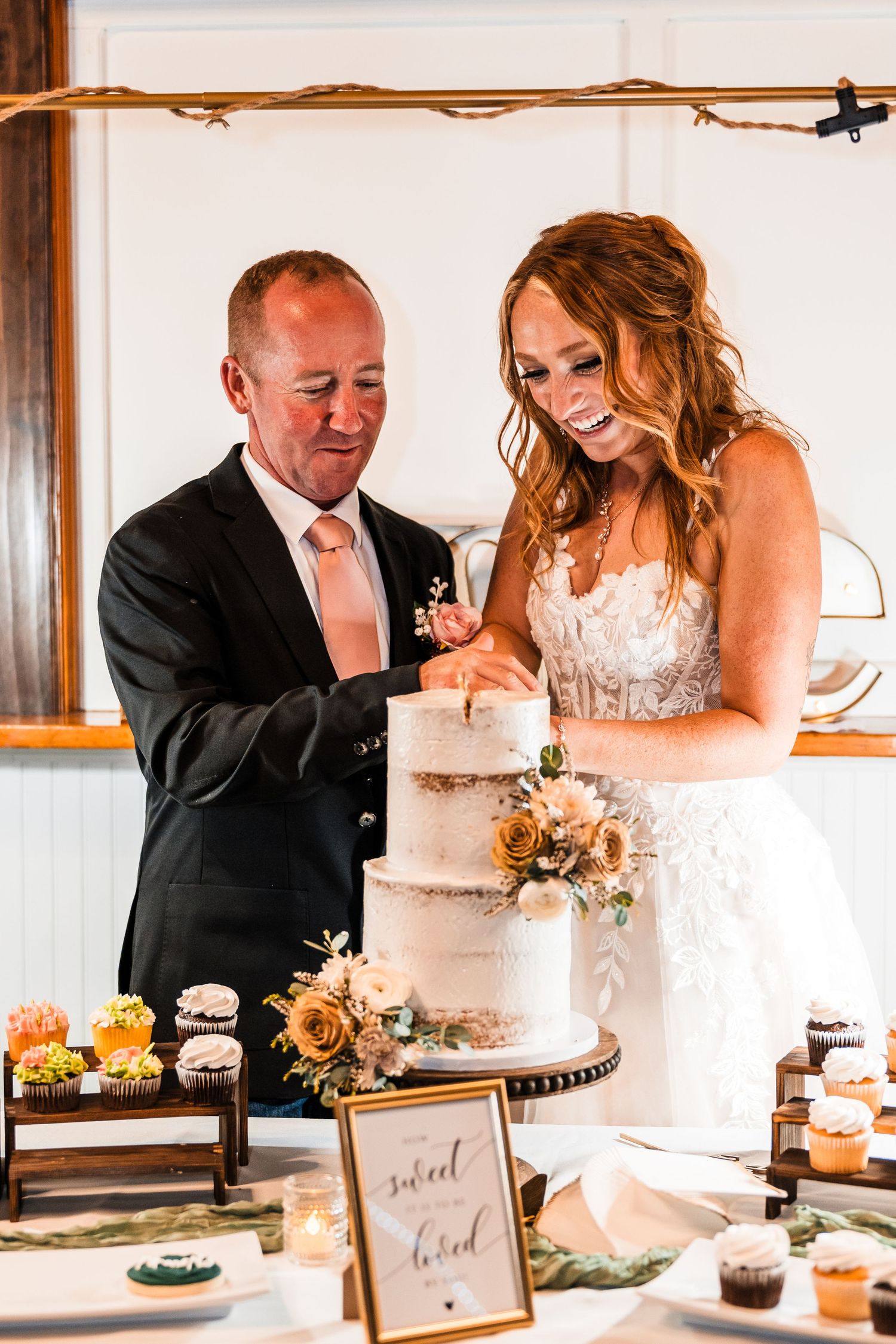 Sequence showing a couple cutting their wedding cake together at the reception.