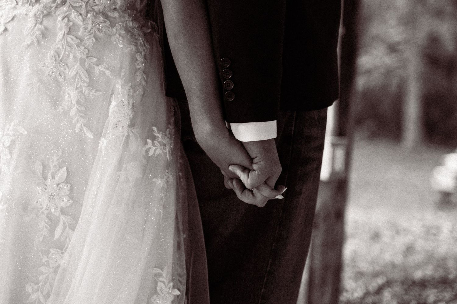 Elegant black and white wedding photography capturing intimate moments and dress details.