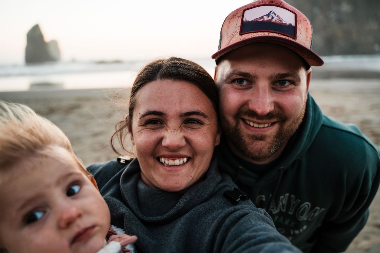 Sunset family portrait at Ruby Beach with sea stacks in the background.