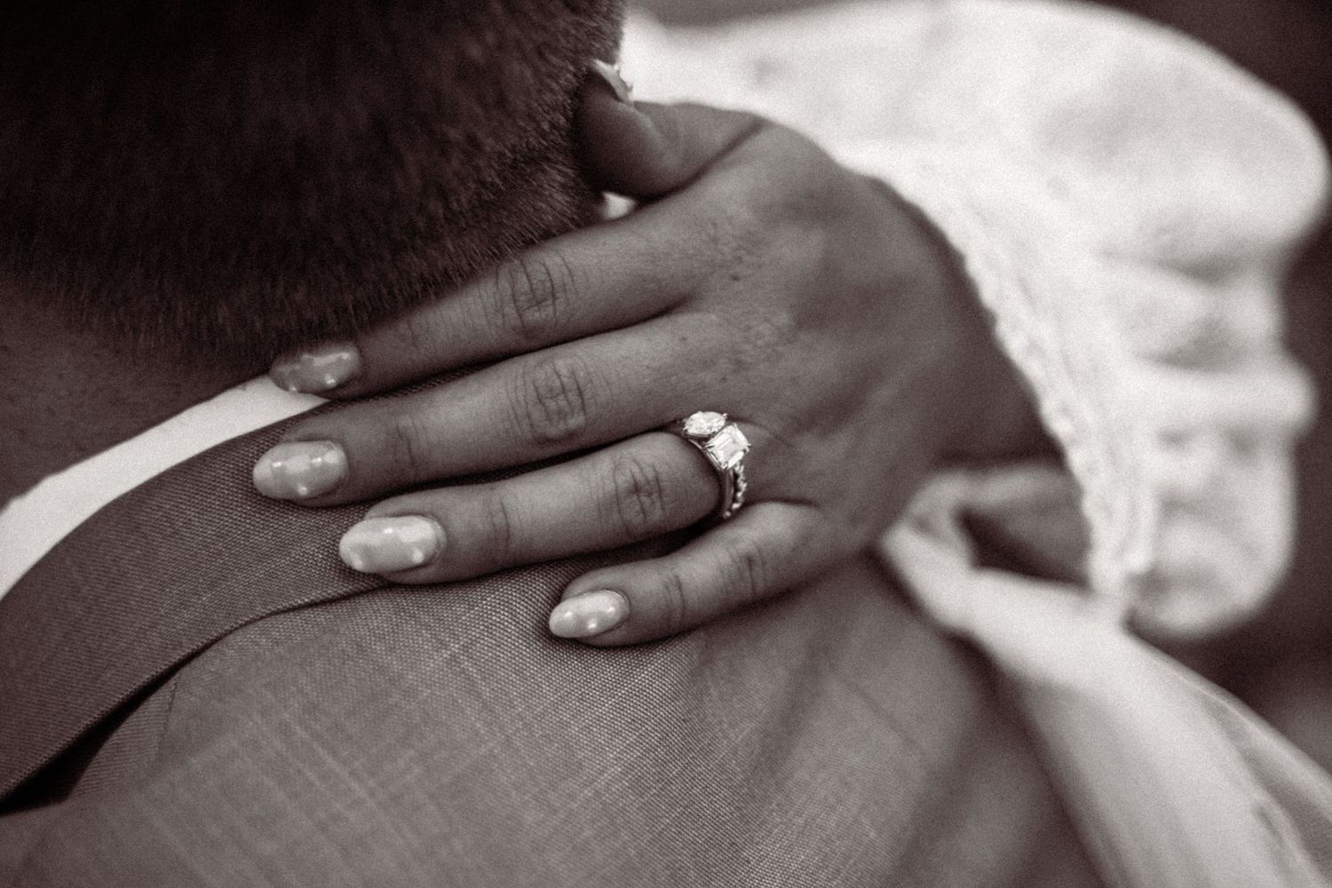 Close-up black and white photo series showing hands with engagement rings and wedding bands in various poses.