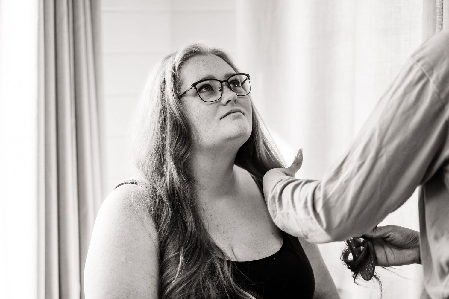 A series of candid headshots of someone in a casual setting with natural light indoors.