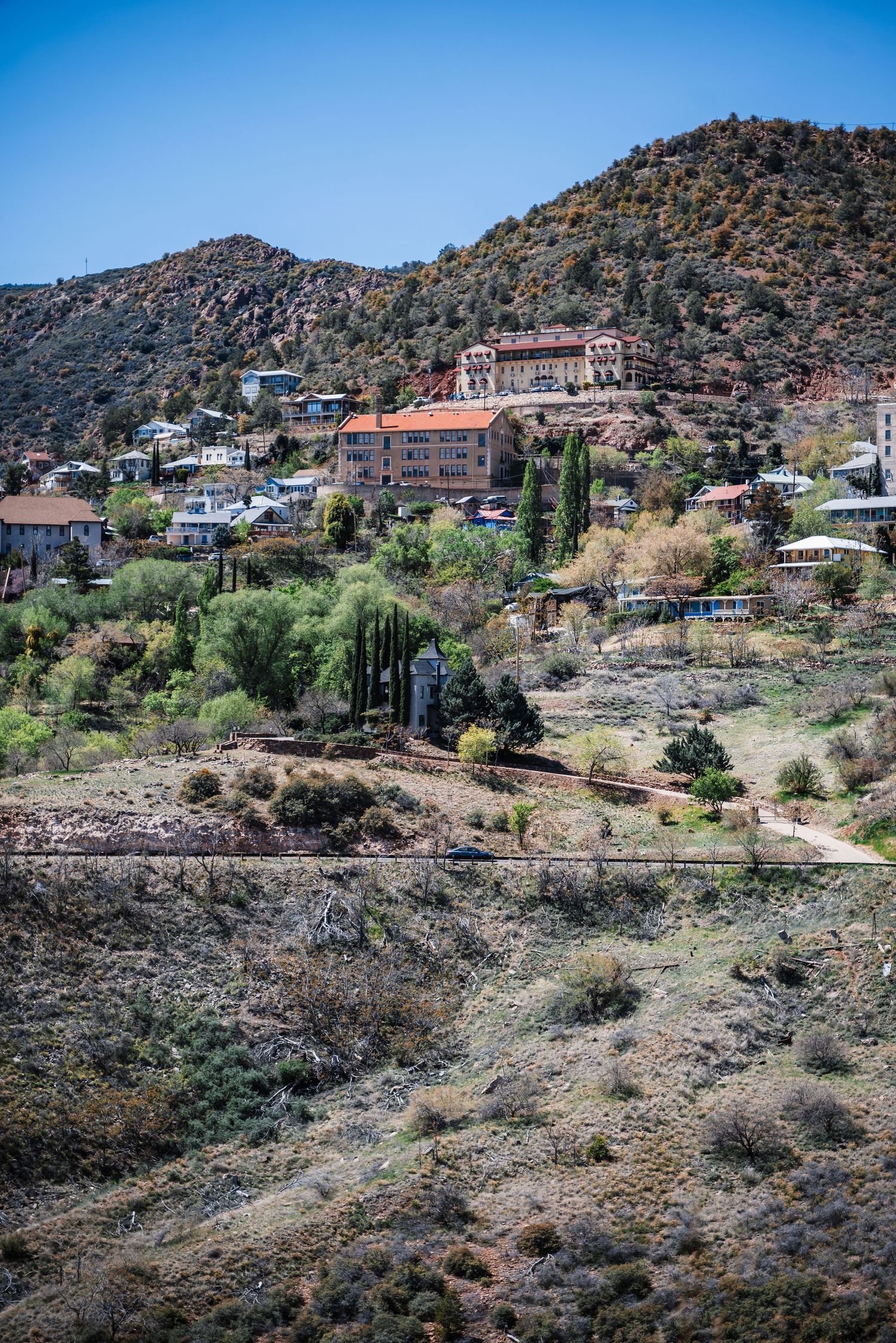 Historic buildings and homes dot the rugged hillside in Jerome, a historic mining town in Arizona.