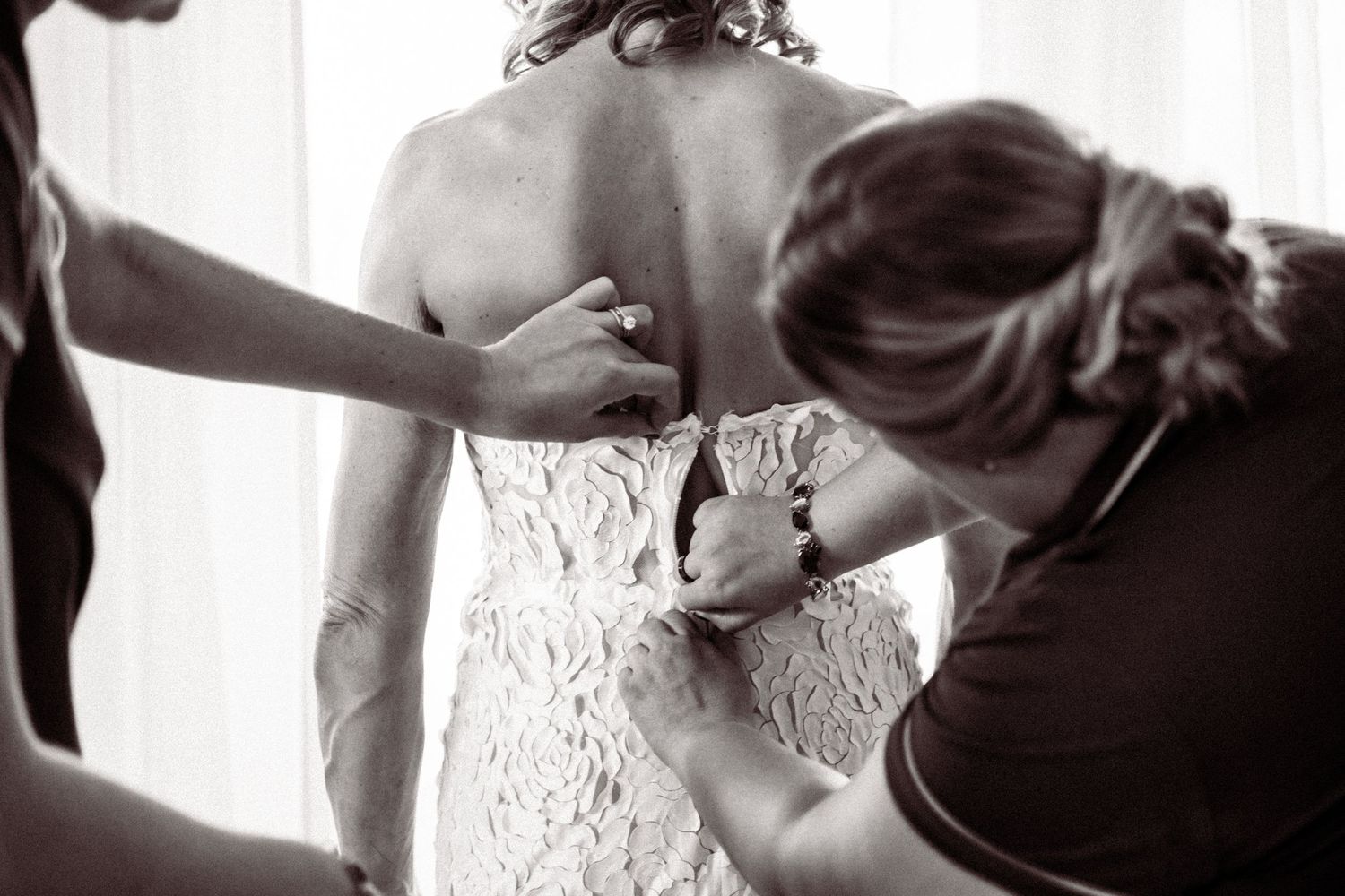 Black and white wedding photography collage showing romantic moments and details of a bride getting ready.