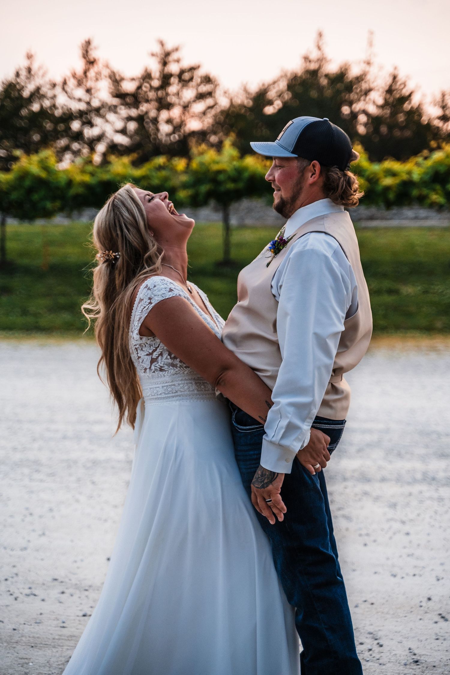 Sunset wedding portraits showing intimate moments between bride and child.