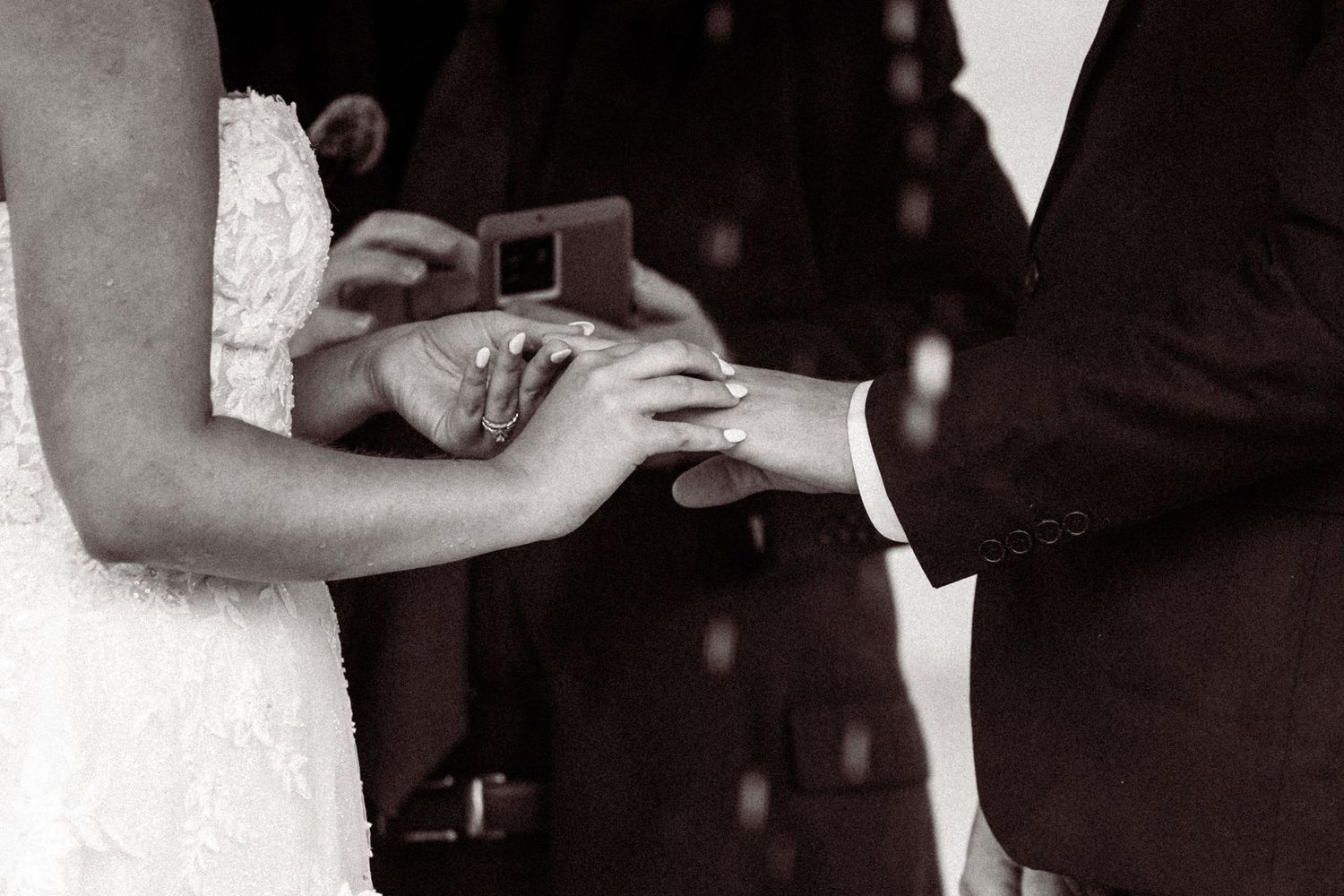 Black and white series of romantic wedding moments between couple.