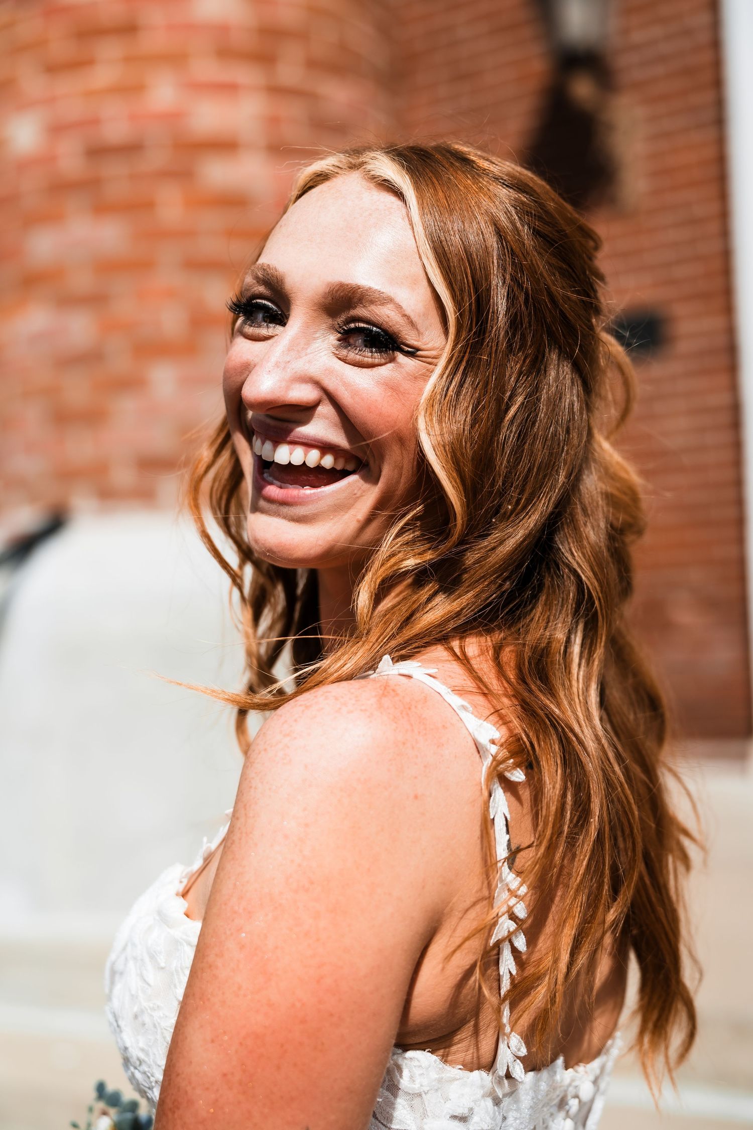 Close up sequence of a person in a white lace dress showing joyful expressions.