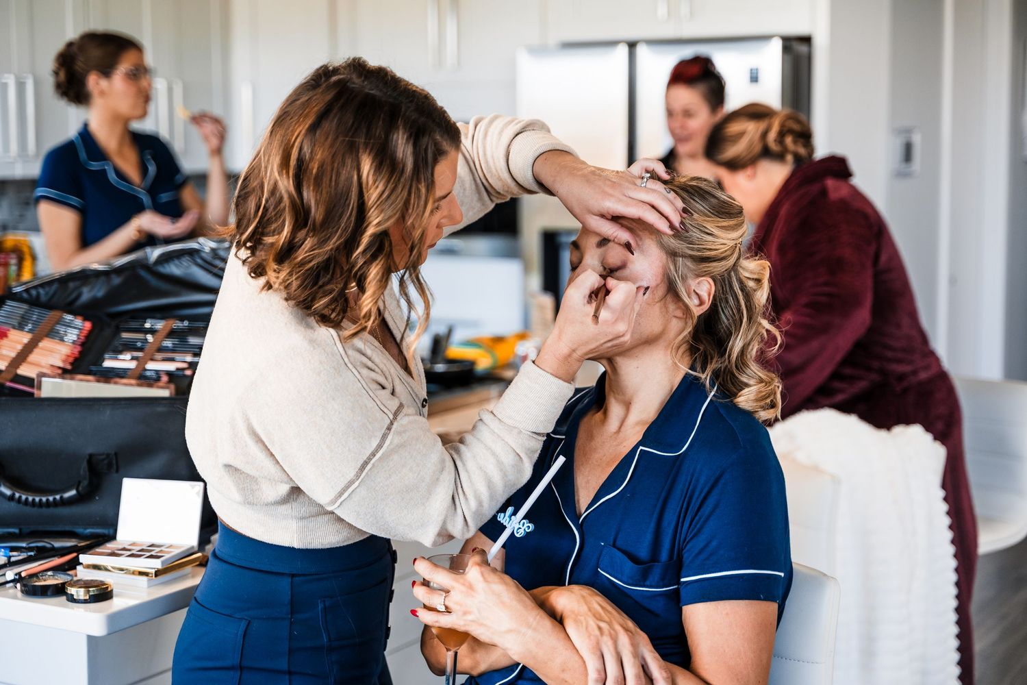 A series of candid moments showing people getting ready in a bright indoor space with white curtains.