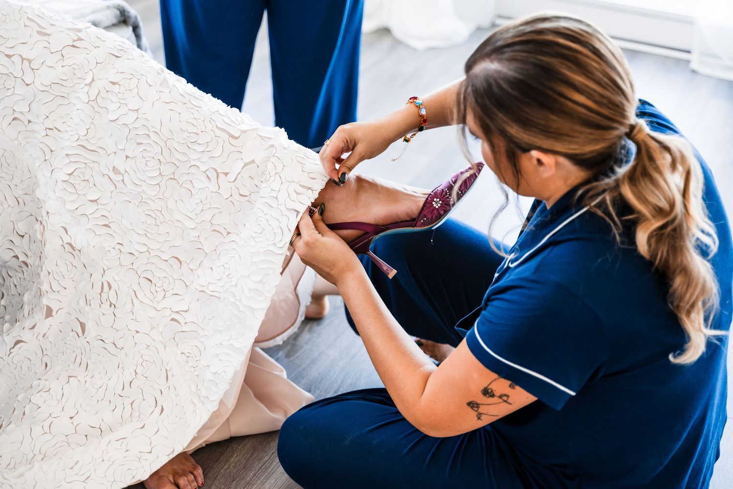 Healthcare professional in blue uniform performing medical examination.