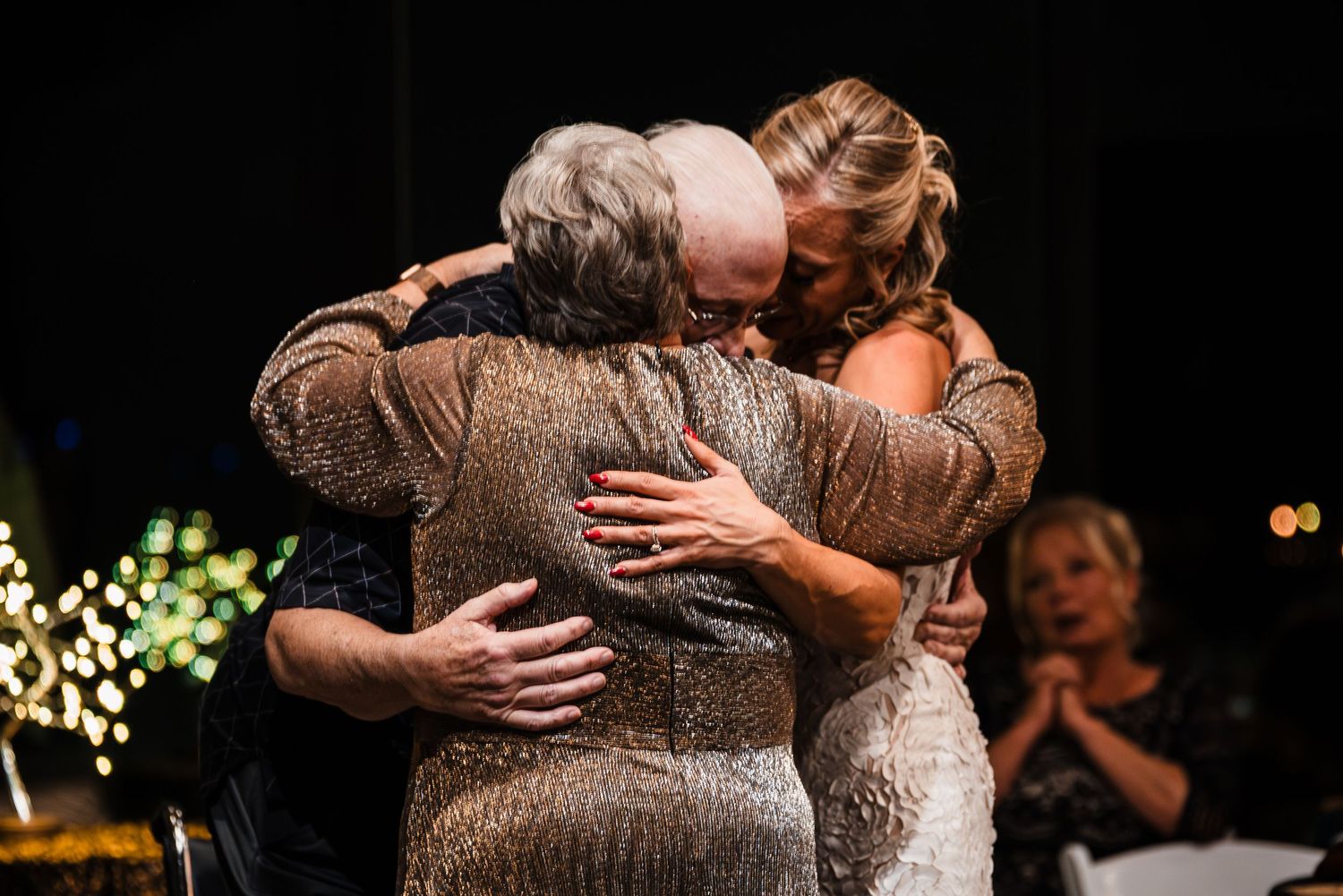 Intimate dance floor moments captured during an evening wedding reception.