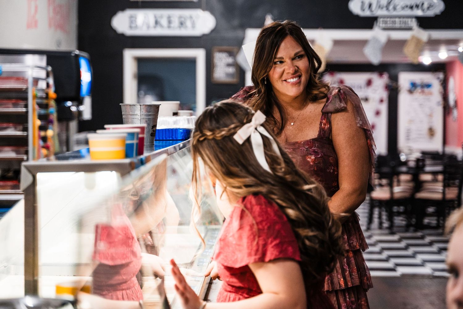 People enjoying ice cream at a vintage-style creamery shop.