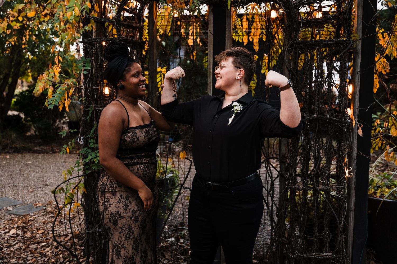 A celebratory moment captured in an autumn garden setting with string lights.