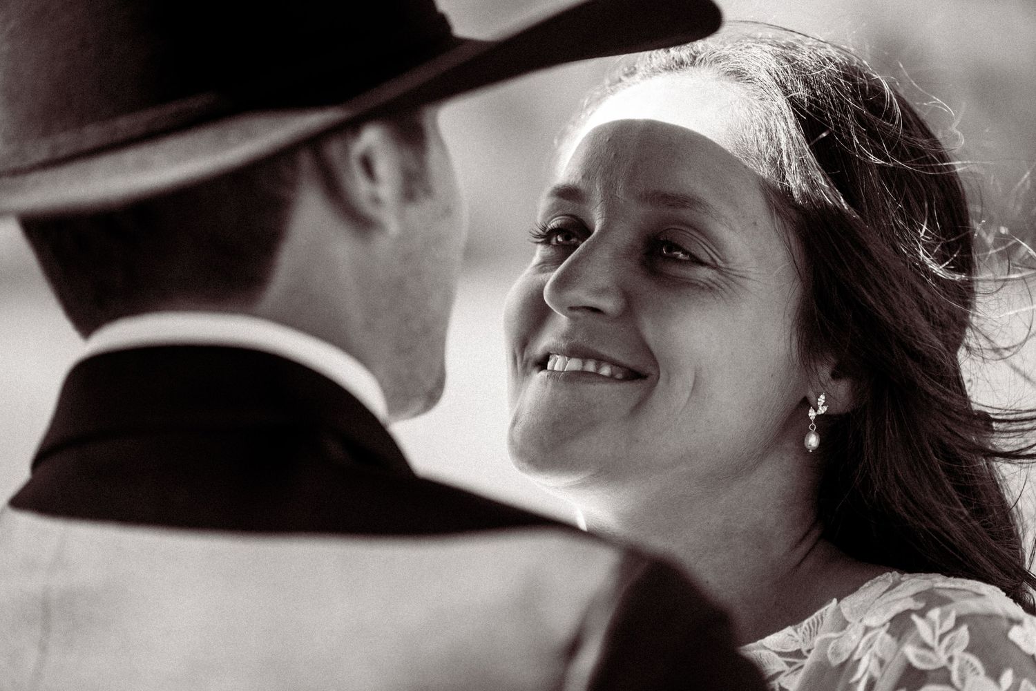 Close-up black and white shots showing intimate moments between a couple.