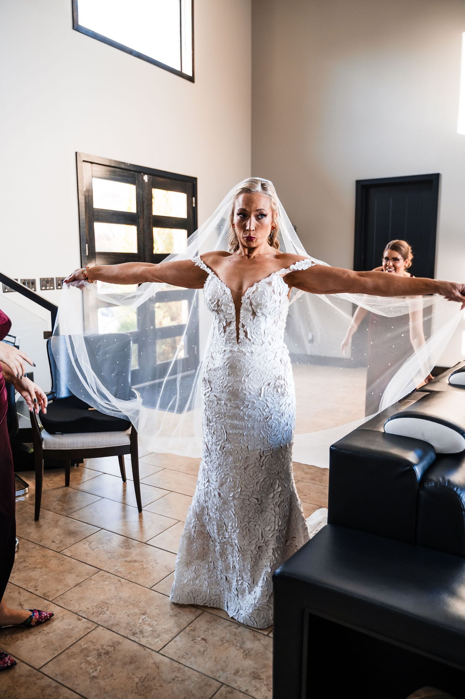 Sequence showing preparation with white wedding dress in modern interior setting.