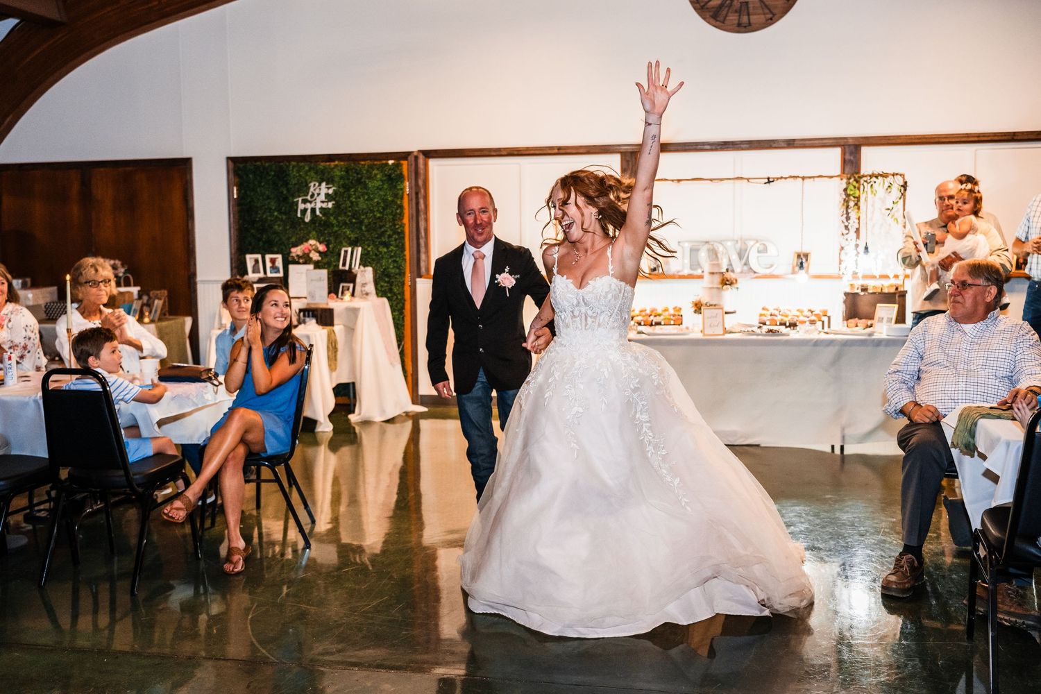 Wedding reception dance floor moments with guests celebrating.